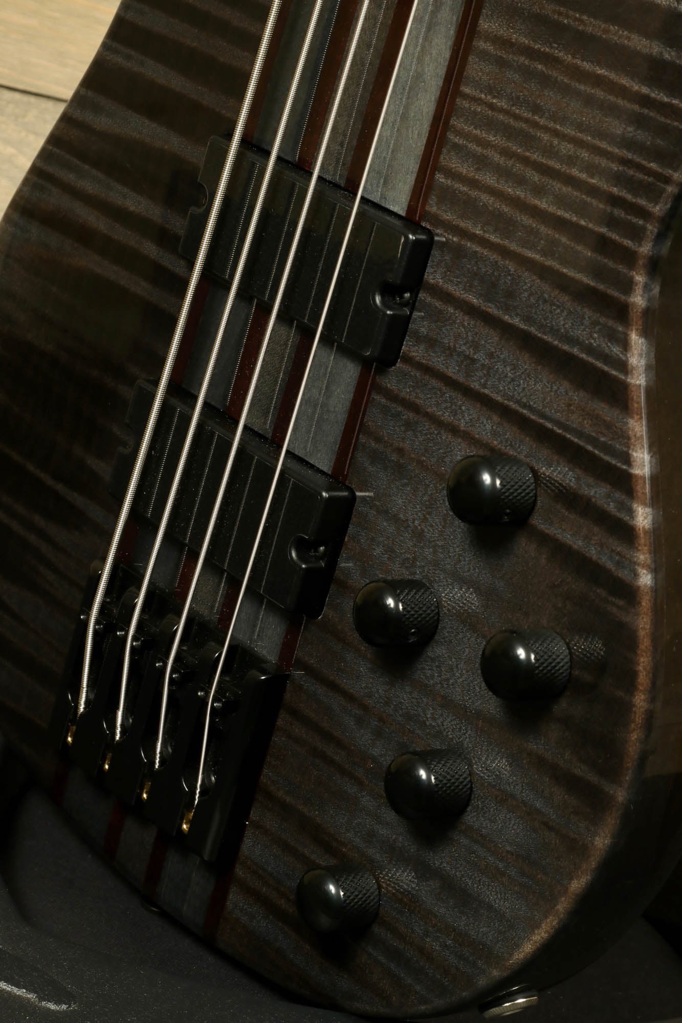 Close-up of Peavey Cirrus 4 bass guitar showcasing its sleek body and control knobs