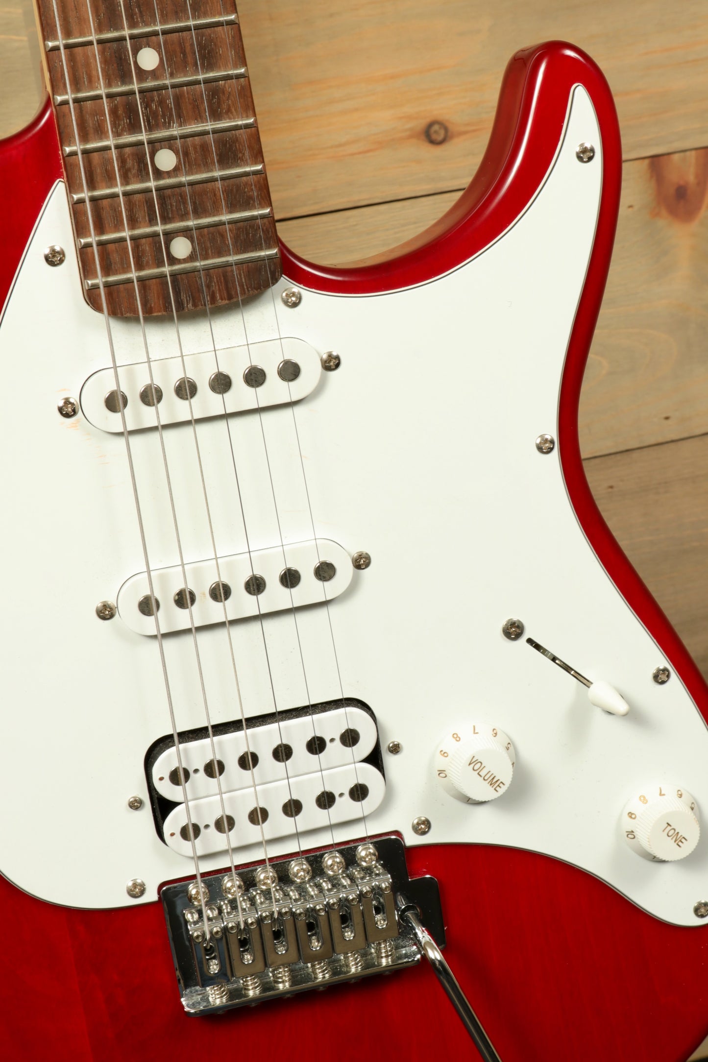 Peavey Raptor Plus - USED electric guitar in shiny red with multiple pickups and adjustable controls