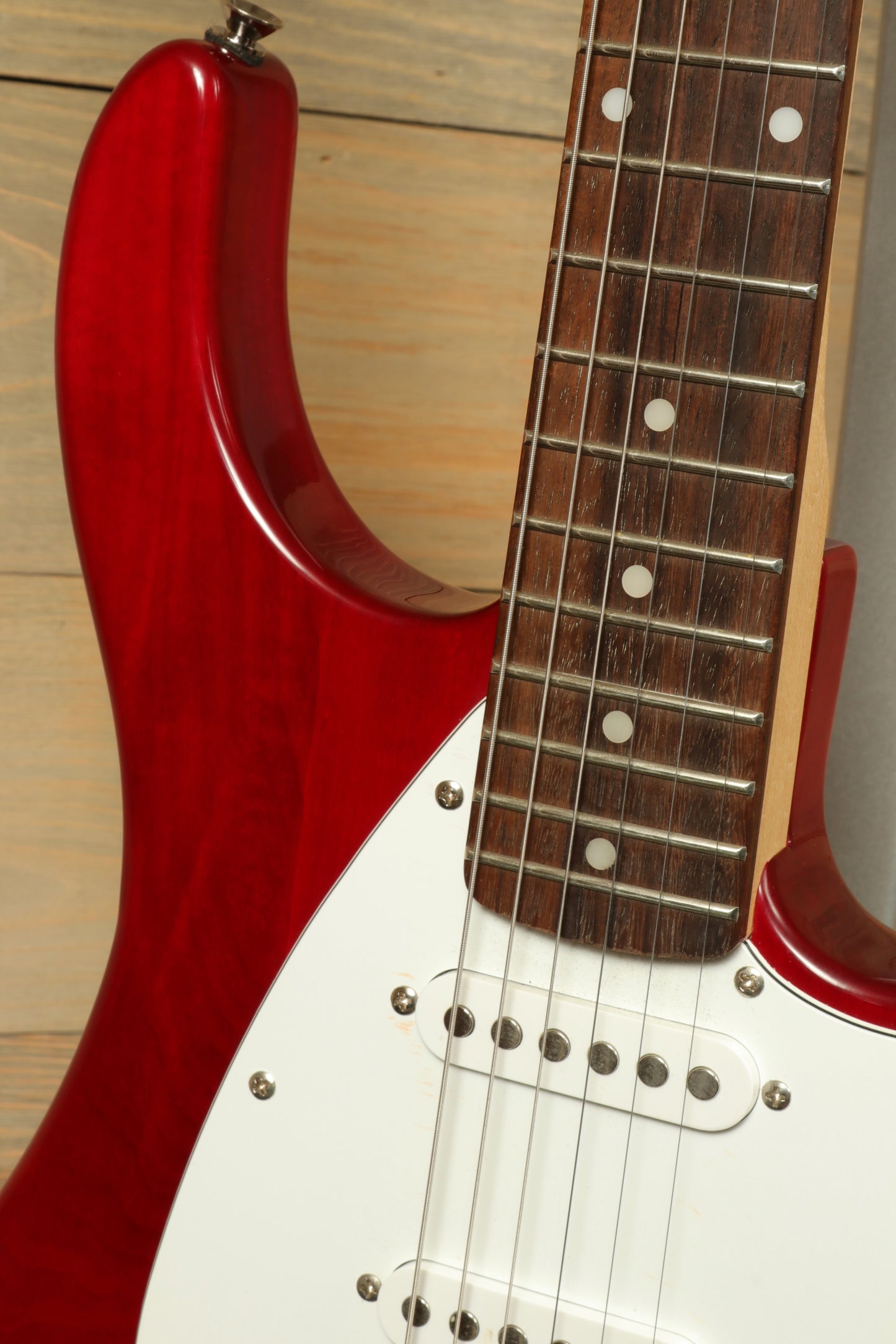 Peavey Raptor Plus - USED electric guitar with a glossy red finish and rosewood fretboard