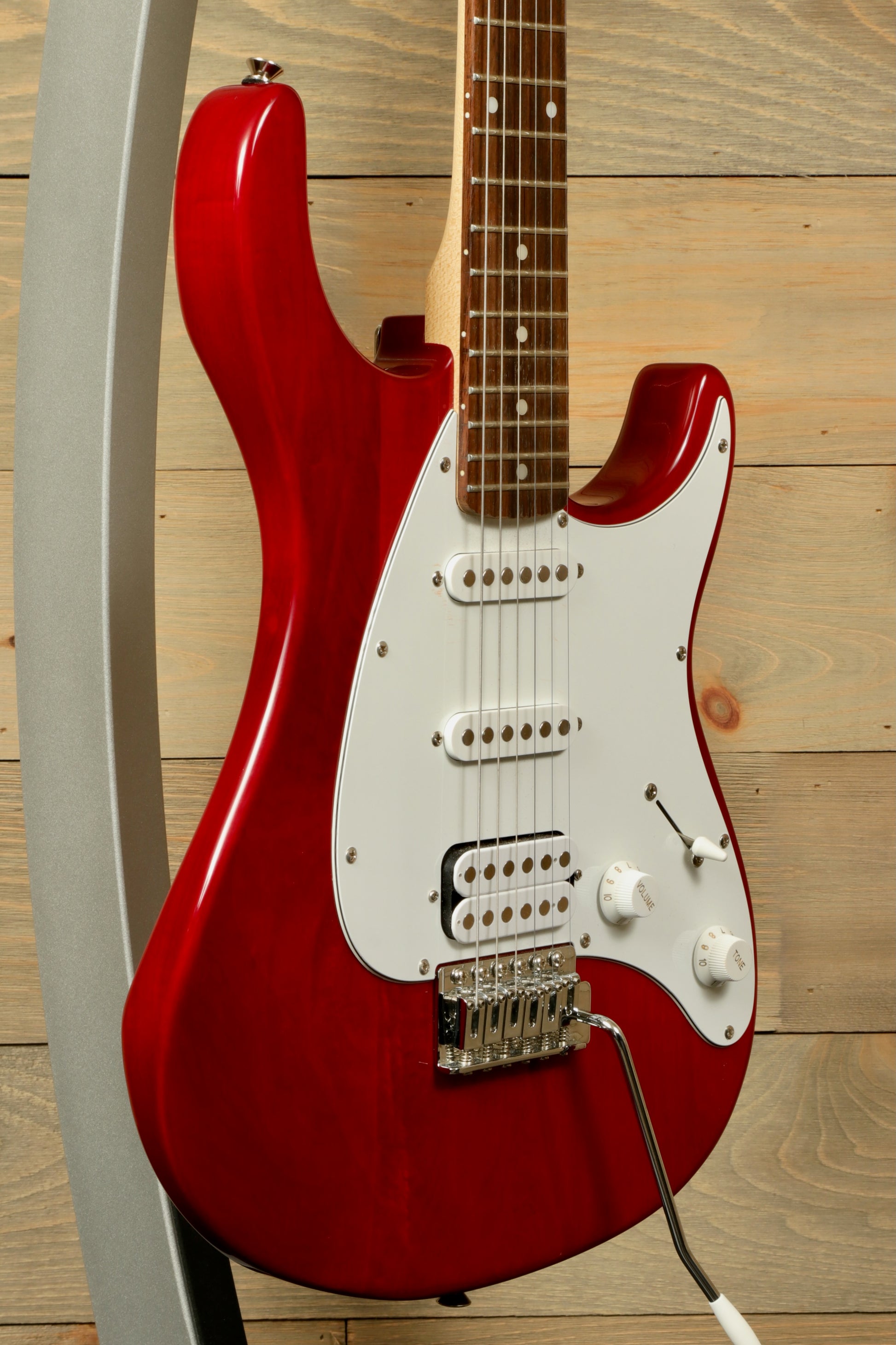 Peavey Raptor Plus - USED electric guitar in red finish with a white pickguard and three pickups