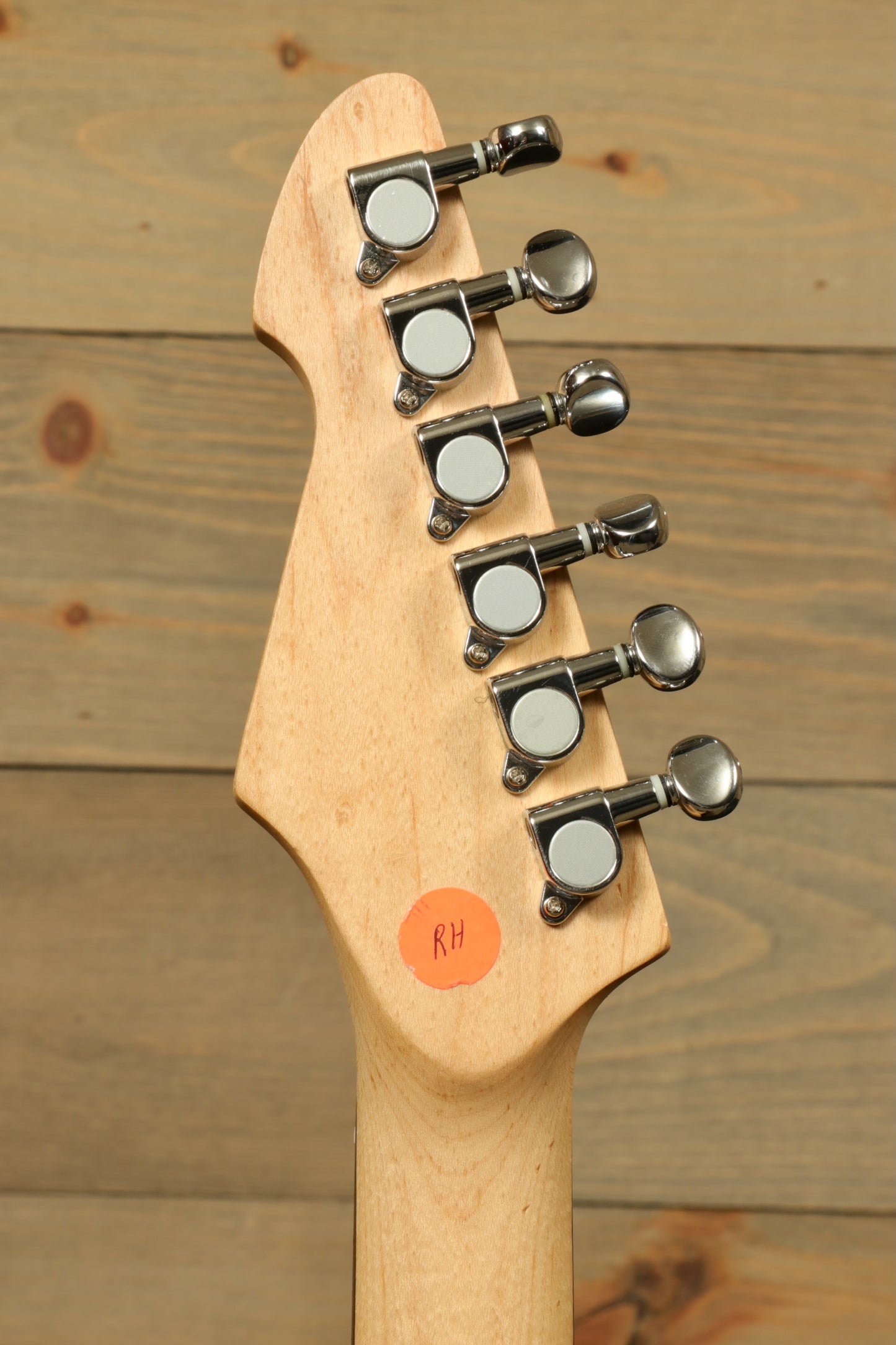 Peavey Raptor Plus - USED electric guitar headstock featuring tuning pegs and natural wood finish