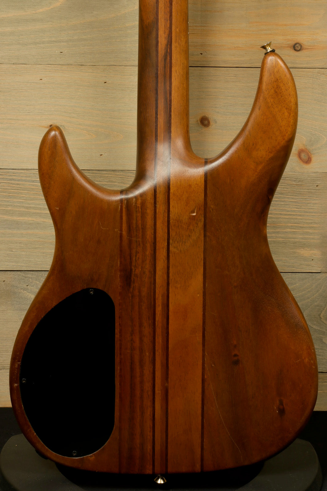 Peavey Vintage Peavey Unity Koa Bass in natural wood finish, rear view highlighting the beautiful grain