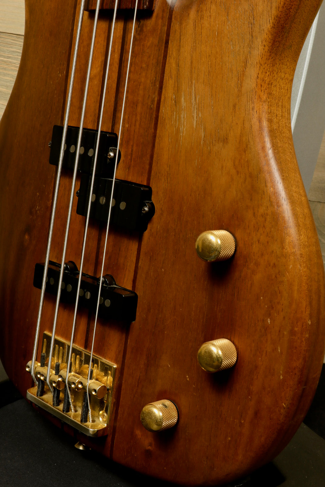 Peavey Vintage Peavey Unity Koa Bass in natural wood finish, close-up view of body and controls