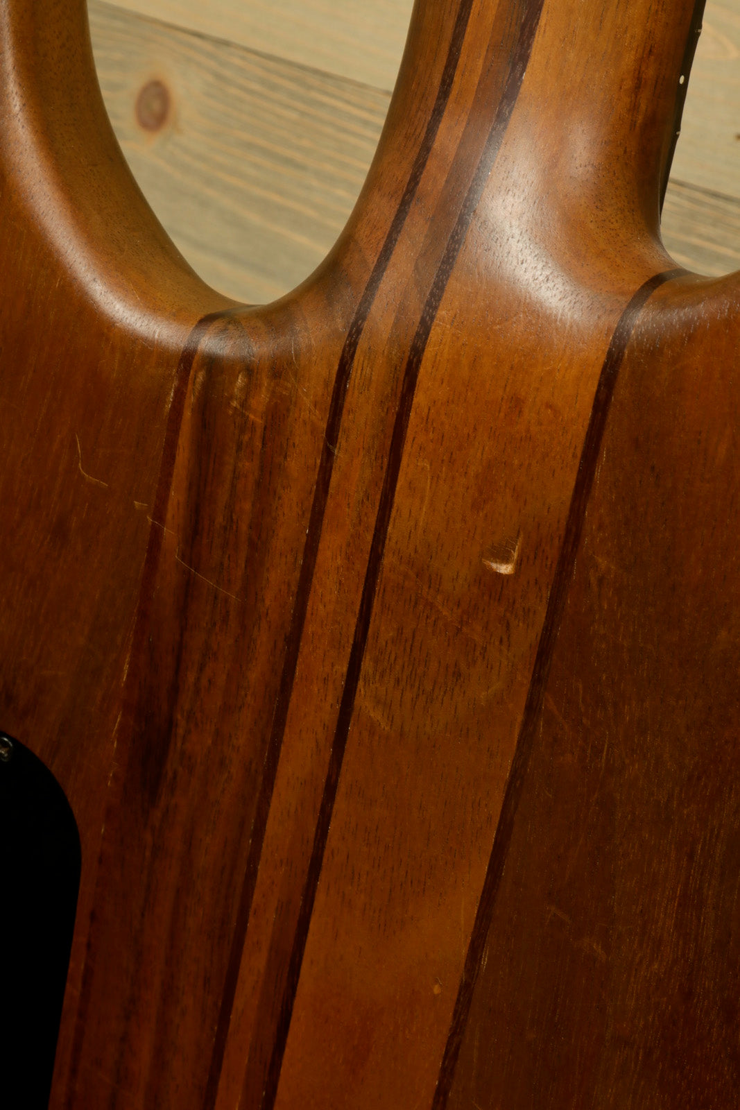 Peavey Vintage Peavey Unity Koa Bass in natural wood finish, close-up view of body grain