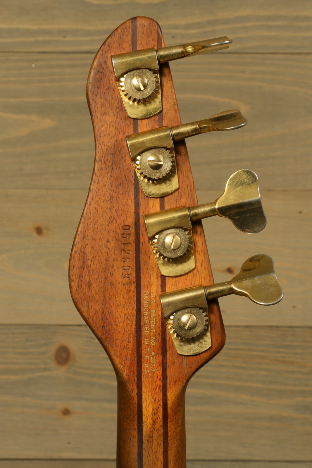 Vintage Peavey Unity Koa Bass neck in natural wood finish, rear view showing tuning pegs