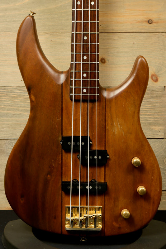 Peavey Vintage Peavey Unity Koa Bass in natural wood finish, front view showcasing pickups and control knobs