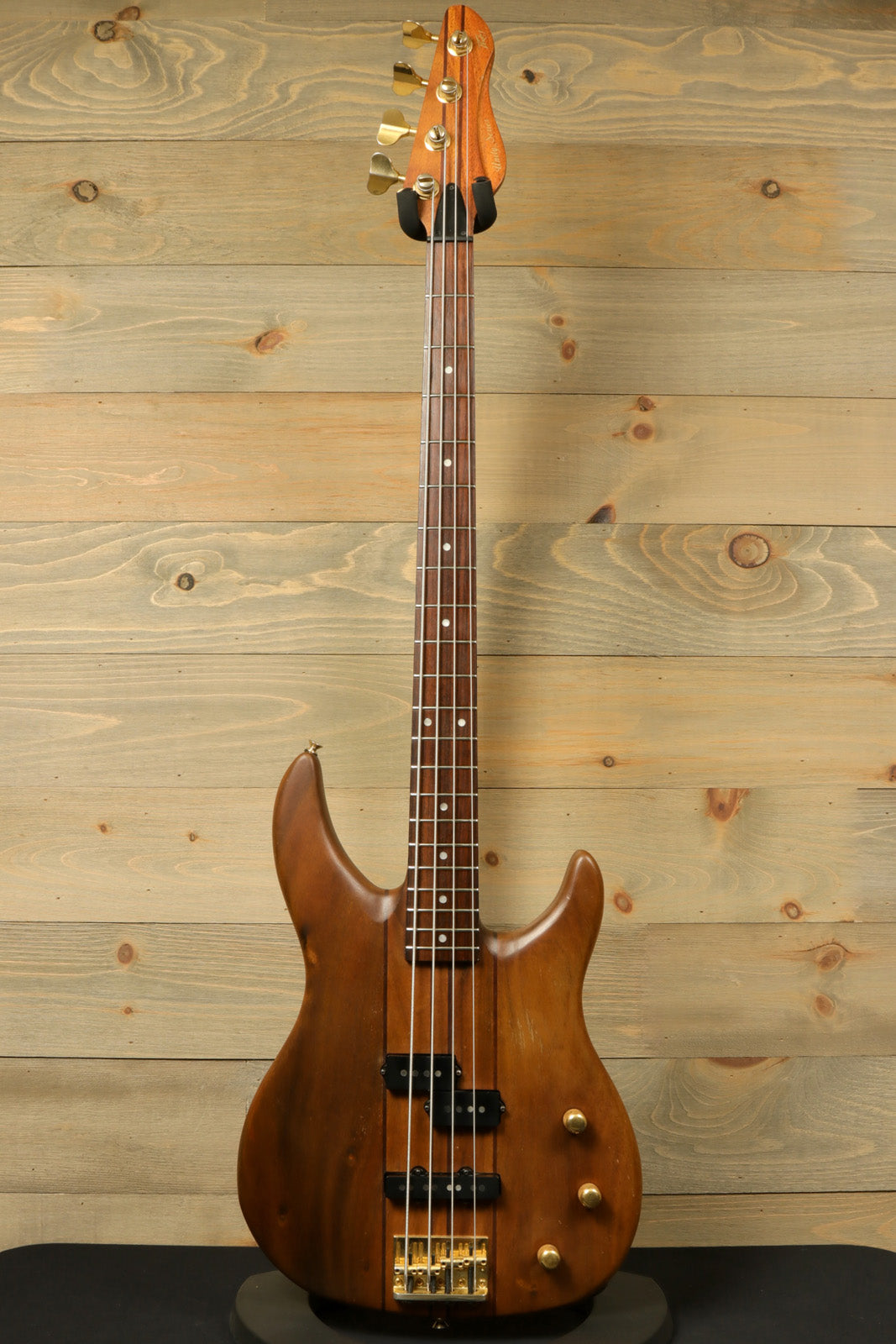 Peavey Vintage Peavey Unity Koa Bass in a natural wood finish, front view showing four strings