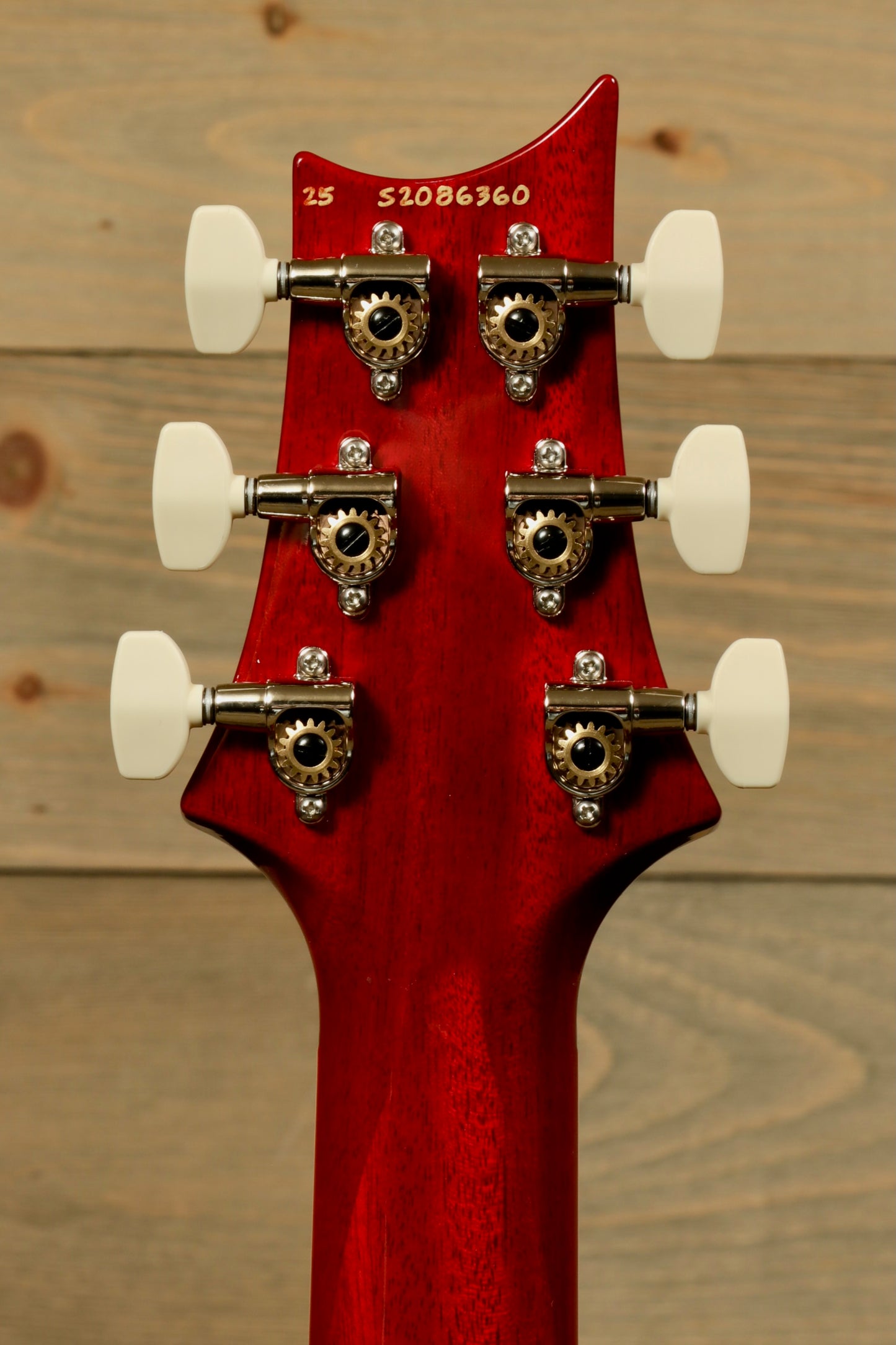 Back view of PRS 594 McCarty electric guitar neck showing tuning pegs and intricate wood grain