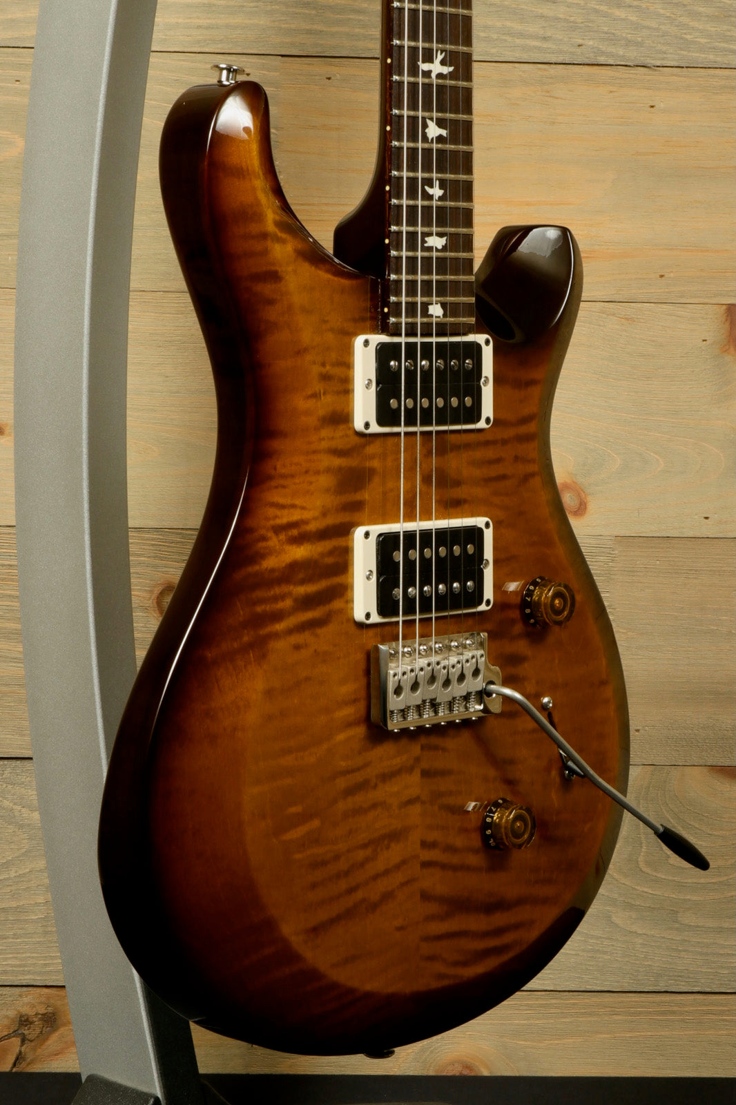PRS USA PRS Custom 24 in amber burst finish, side view showcasing wood grain and hardware