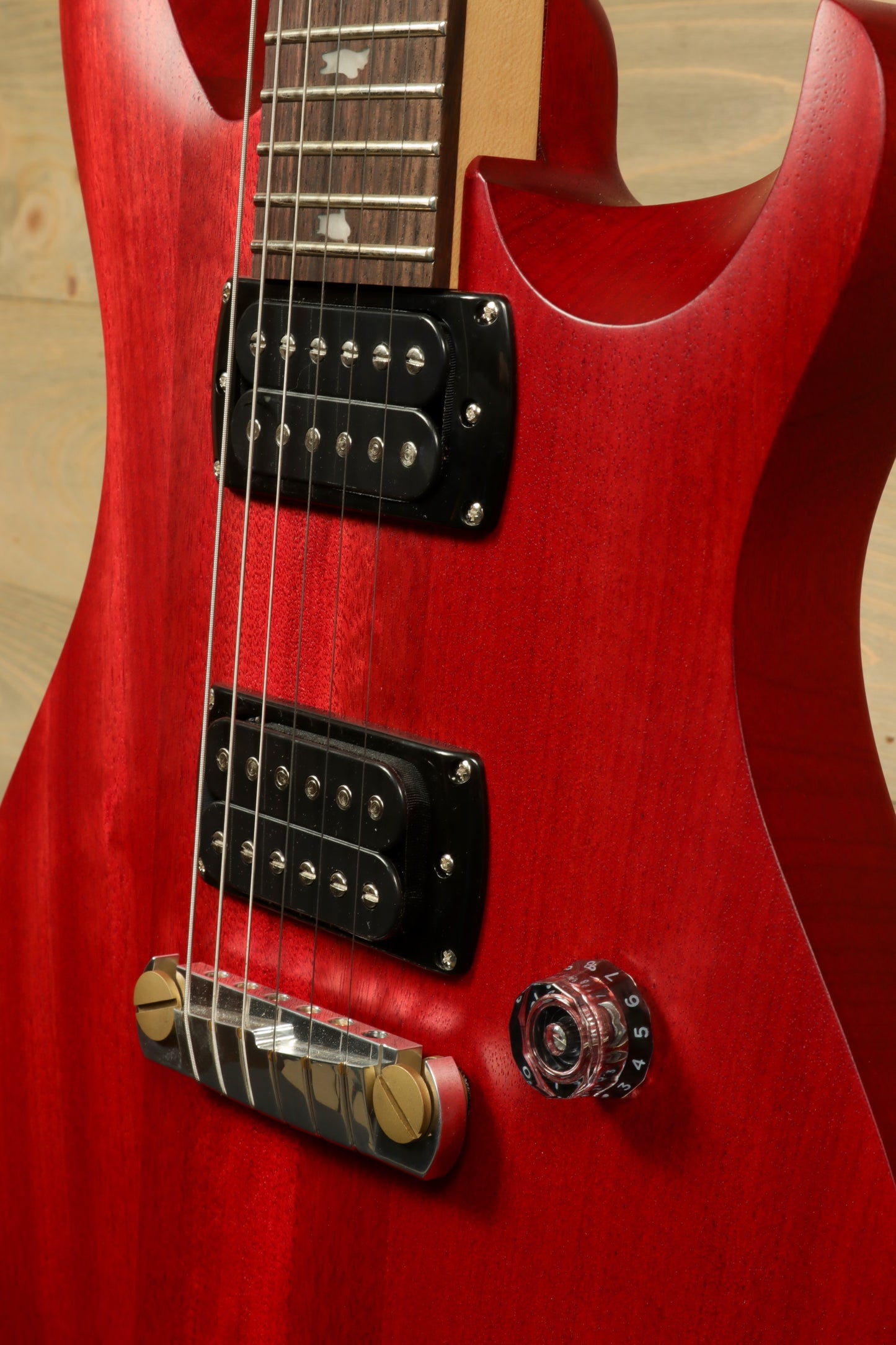 PRS SE CE24 Standard Stoptail guitar in stunning red finish featuring humbucker pickups and control knob