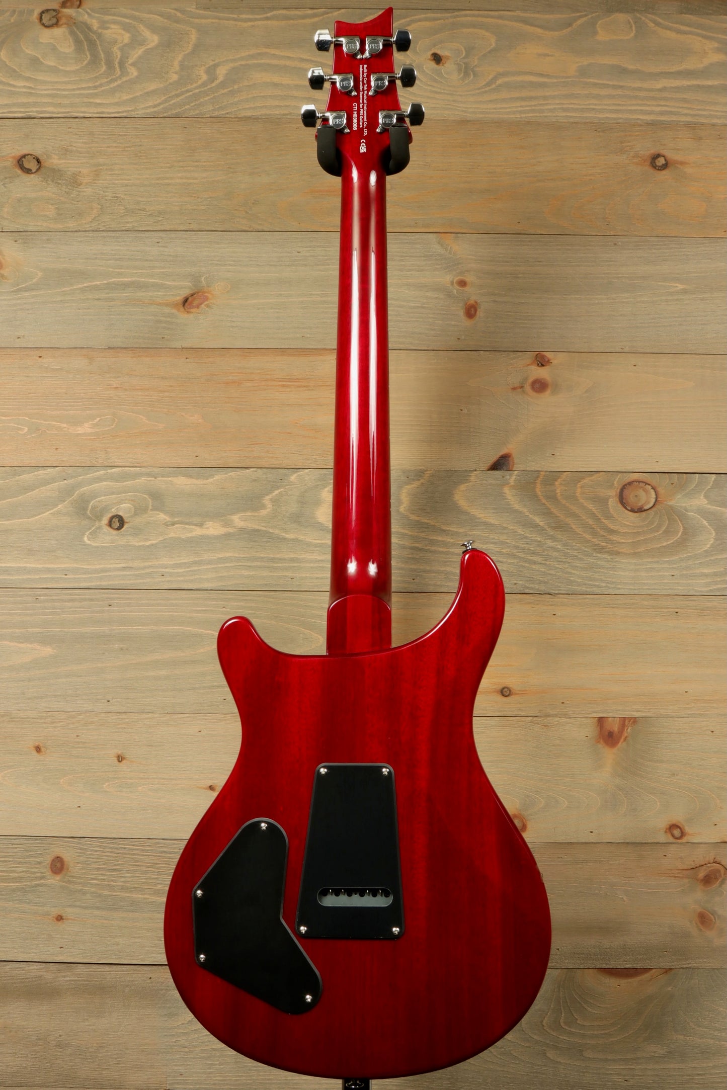 Back view of PRS SE DGT Standard guitar in red showing elegant design and sleek finish