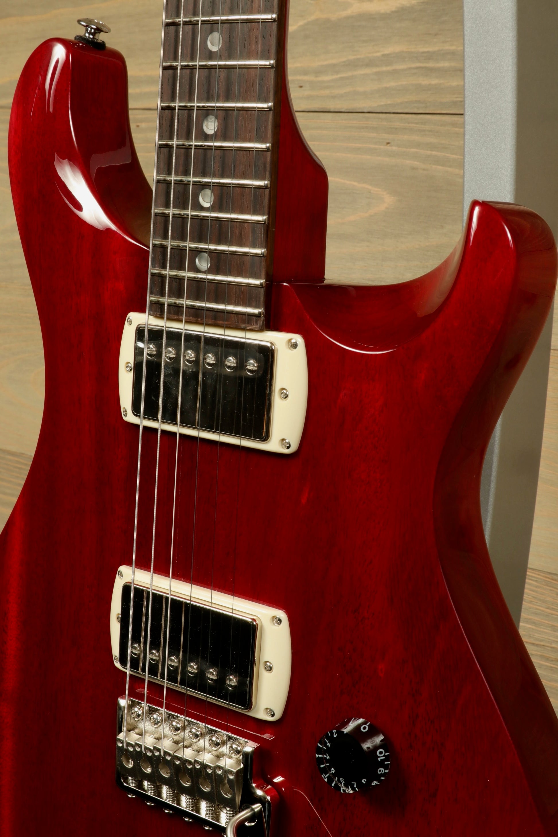 PRS SE DGT Standard guitar in red finish with dual humbucker pickups and a sleek body design