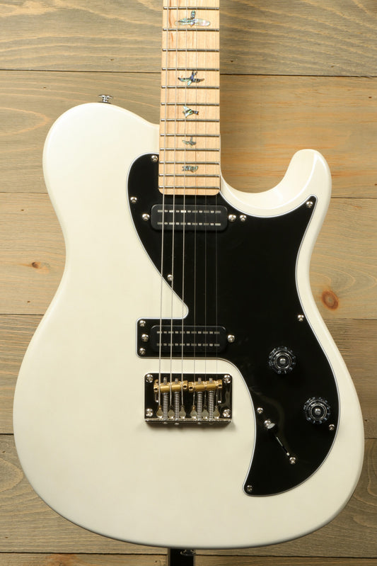 PRS SE NF53 white finish with black pickguard, front view on wooden background