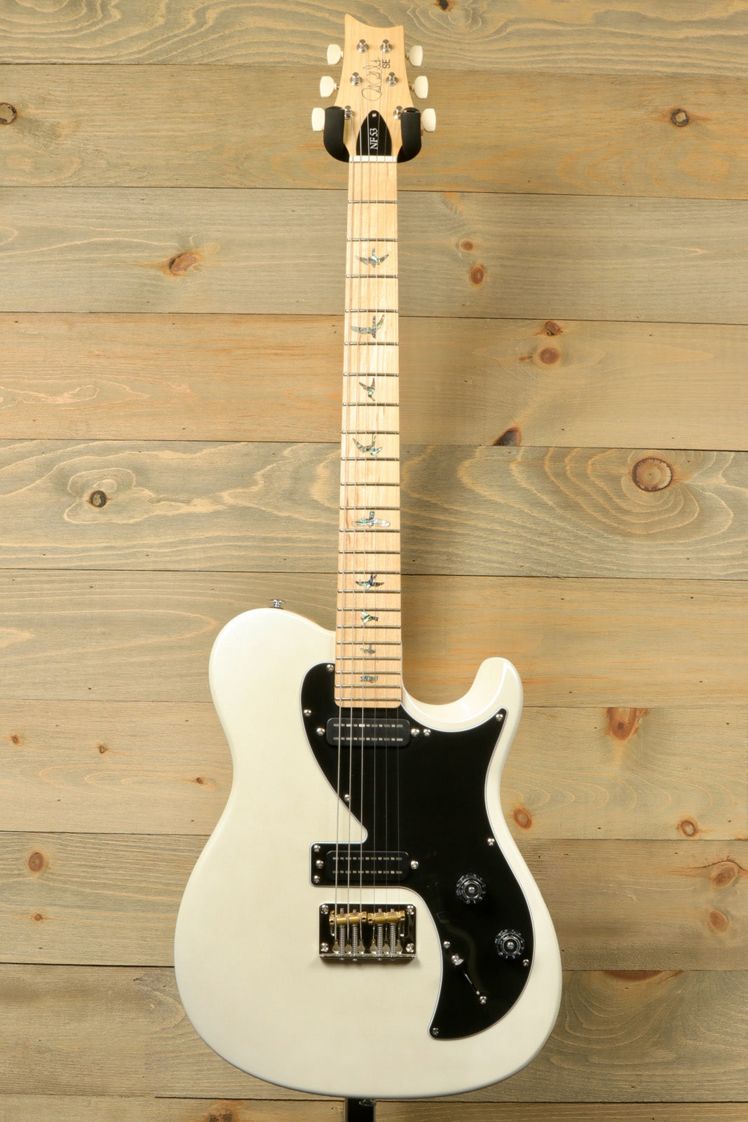 PRS SE NF53 cream white, front view with black pickguard and detailed fingerboard inlays
