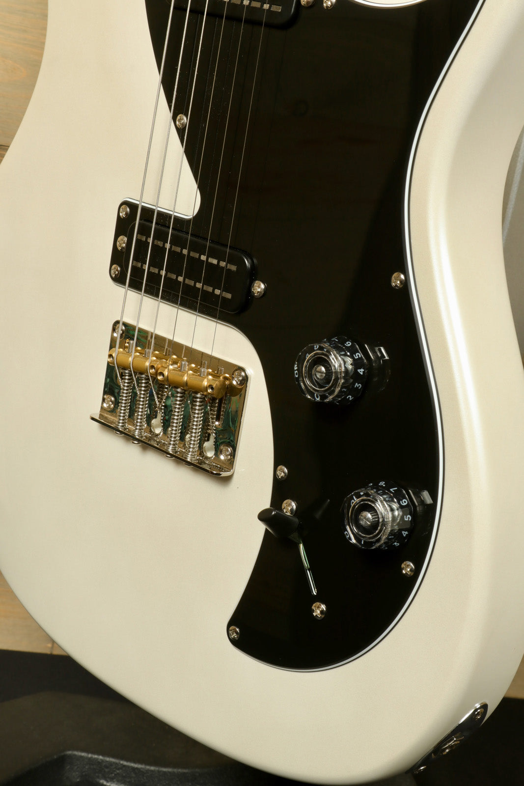 PRS SE NF53 in white, close-up view showcasing body and control knobs