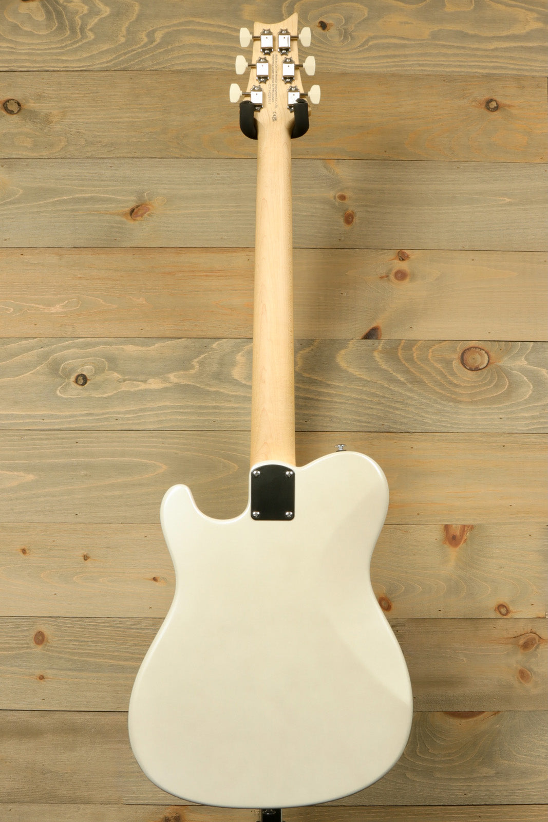 PRS SE NF53 white finish, back view showcasing smooth contours and sleek design