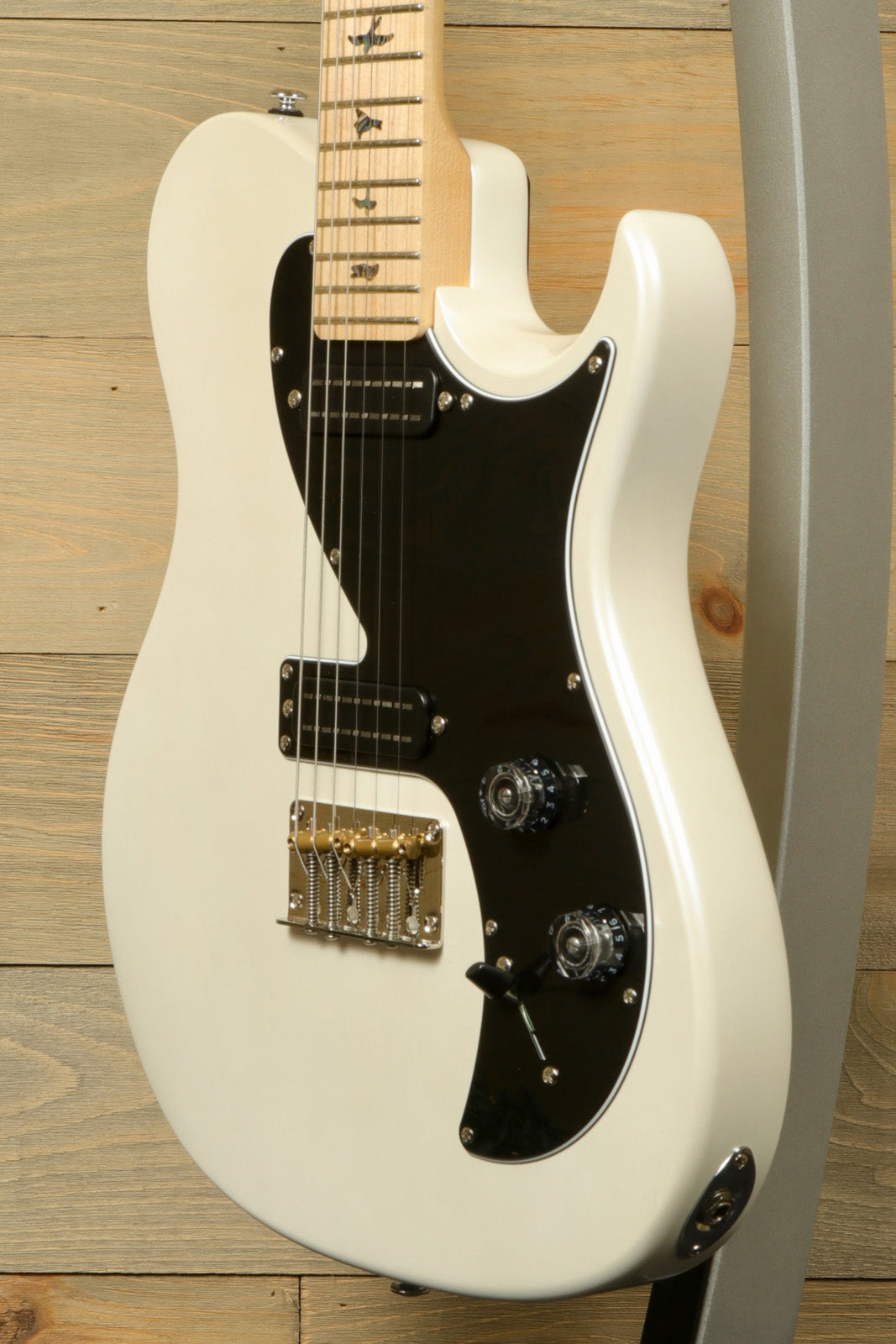 PRS SE NF53 cream white electric guitar with black pickguard, front view