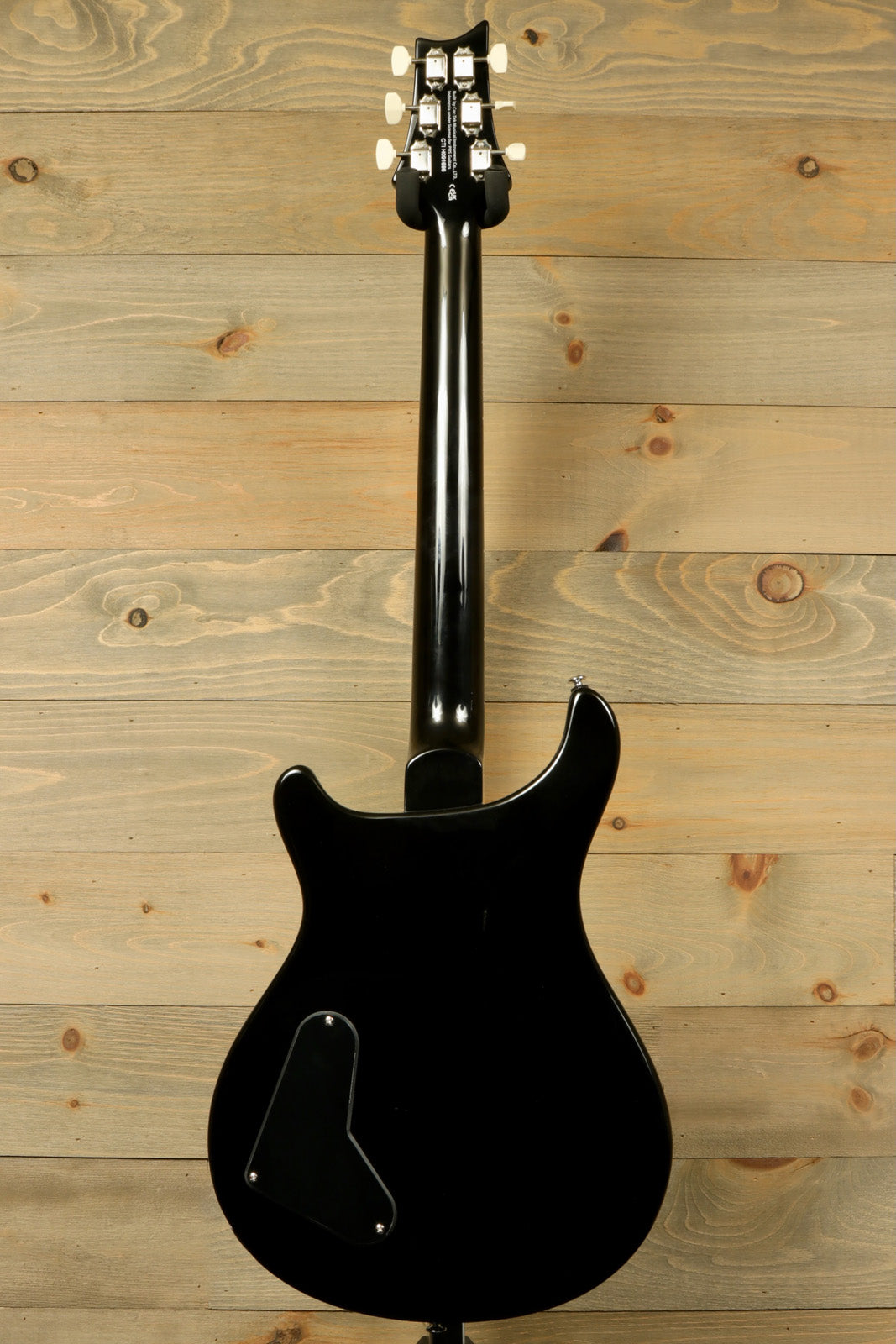 PRS SE Paul's Guitar black, back view showcasing smooth finish and sleek design