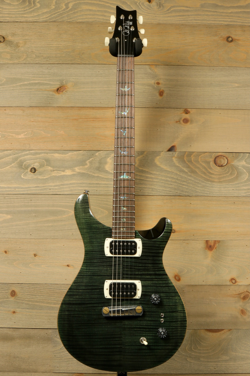 PRS SE Paul's Guitar in charcoal burst, front view with dual pickups and sleek design