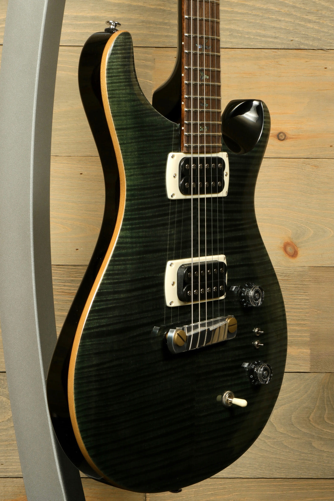 PRS SE Paul's Guitar in black burst finish, side view showcasing body and pickups