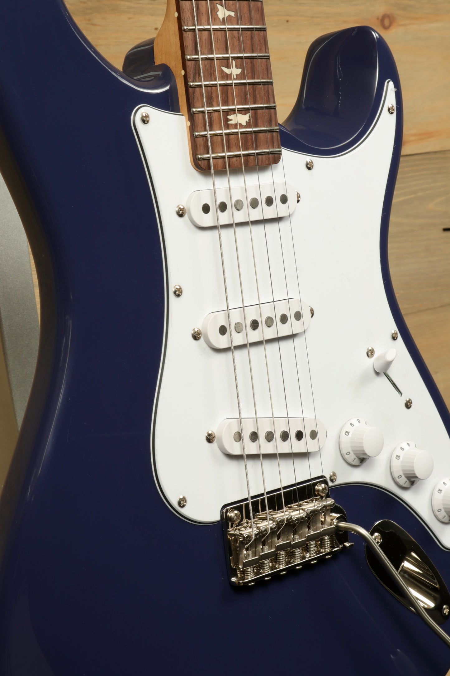 PRS SE Silver Sky Electric Guitar - Trad Blue with Rosewood Fingerboard, close-up view of body and neck
