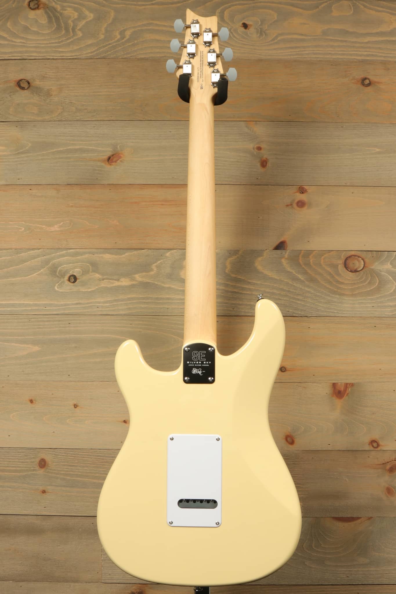 Back view of PRS SE Silver Sky - Moon White electric guitar showcasing sleek design and tuning pegs