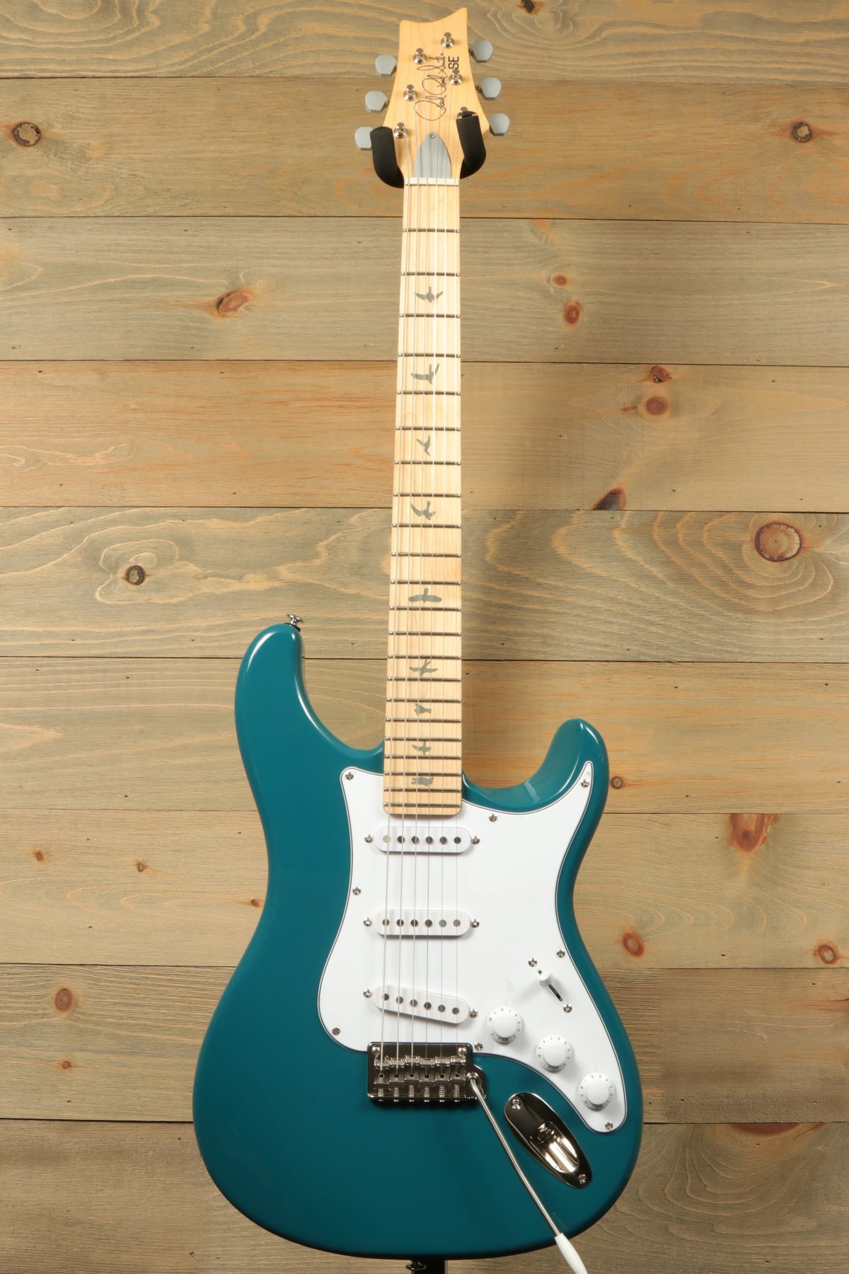 PRS SE Silver Sky - Nylon Blue Electric Guitar, front view with white pickguard and maple fretboard