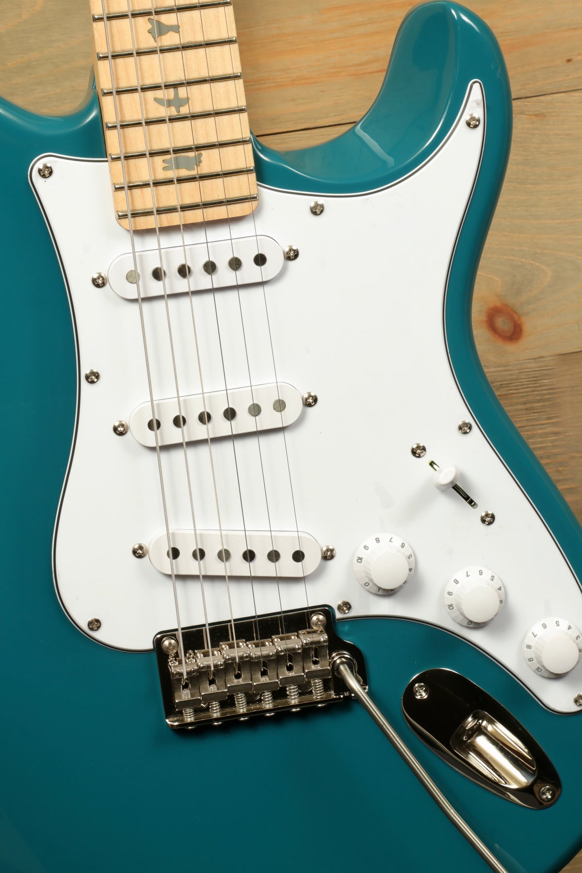 PRS SE Silver Sky - Nylon Blue Electric Guitar, top view with white pickguard and chrome hardware