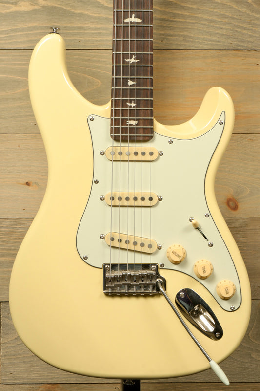 PRS SE Silver Sky in creamy white finish, front view with vintage-style pickups, used condition, includes gig bag