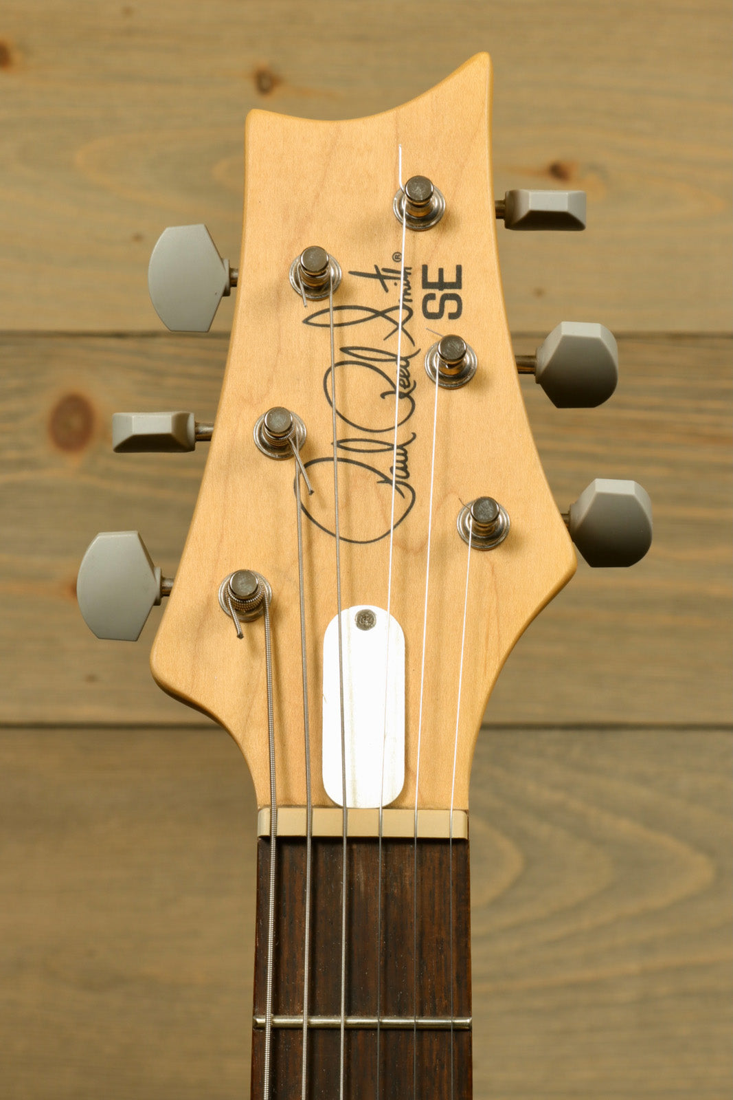 PRS SE Silver Sky used electric guitar, natural finish, headstock view with PRS gig bag