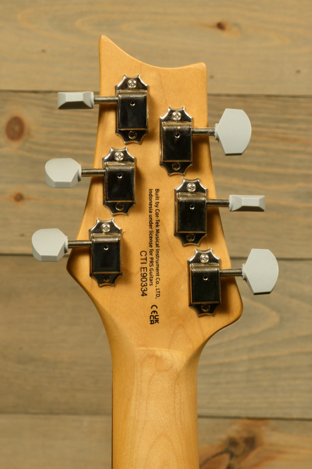 PRS SE Silver Sky used electric guitar back view with tuning pegs and natural wood finish