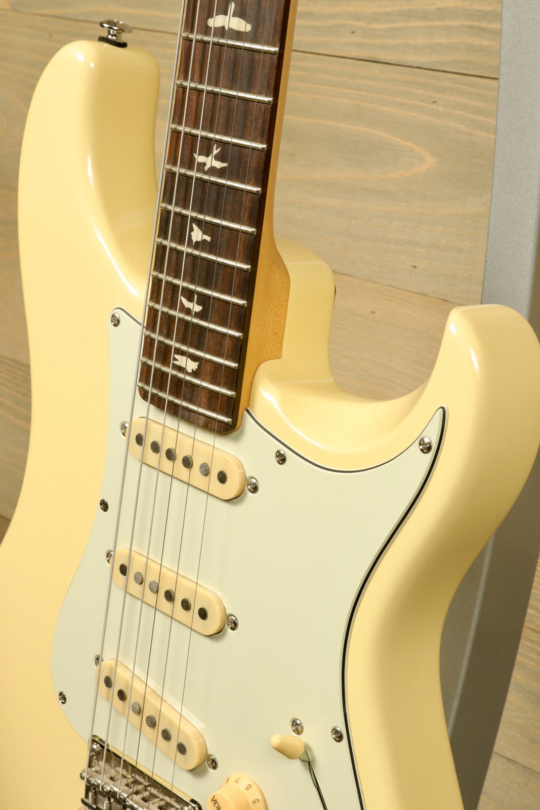 PRS SE Silver Sky in cream color, angled view with rosewood fretboard and vintage style pickups - USED