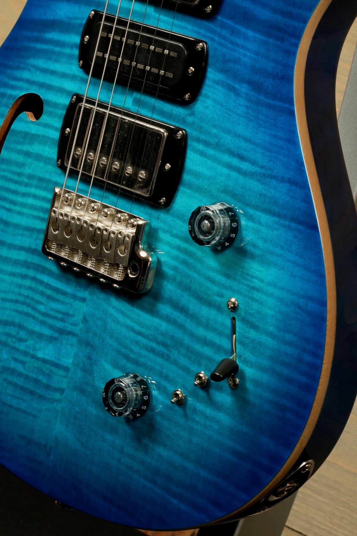 PRS SE Special Semi-Hollow electric guitar in vivid blue with a stunning flamed finish, front view