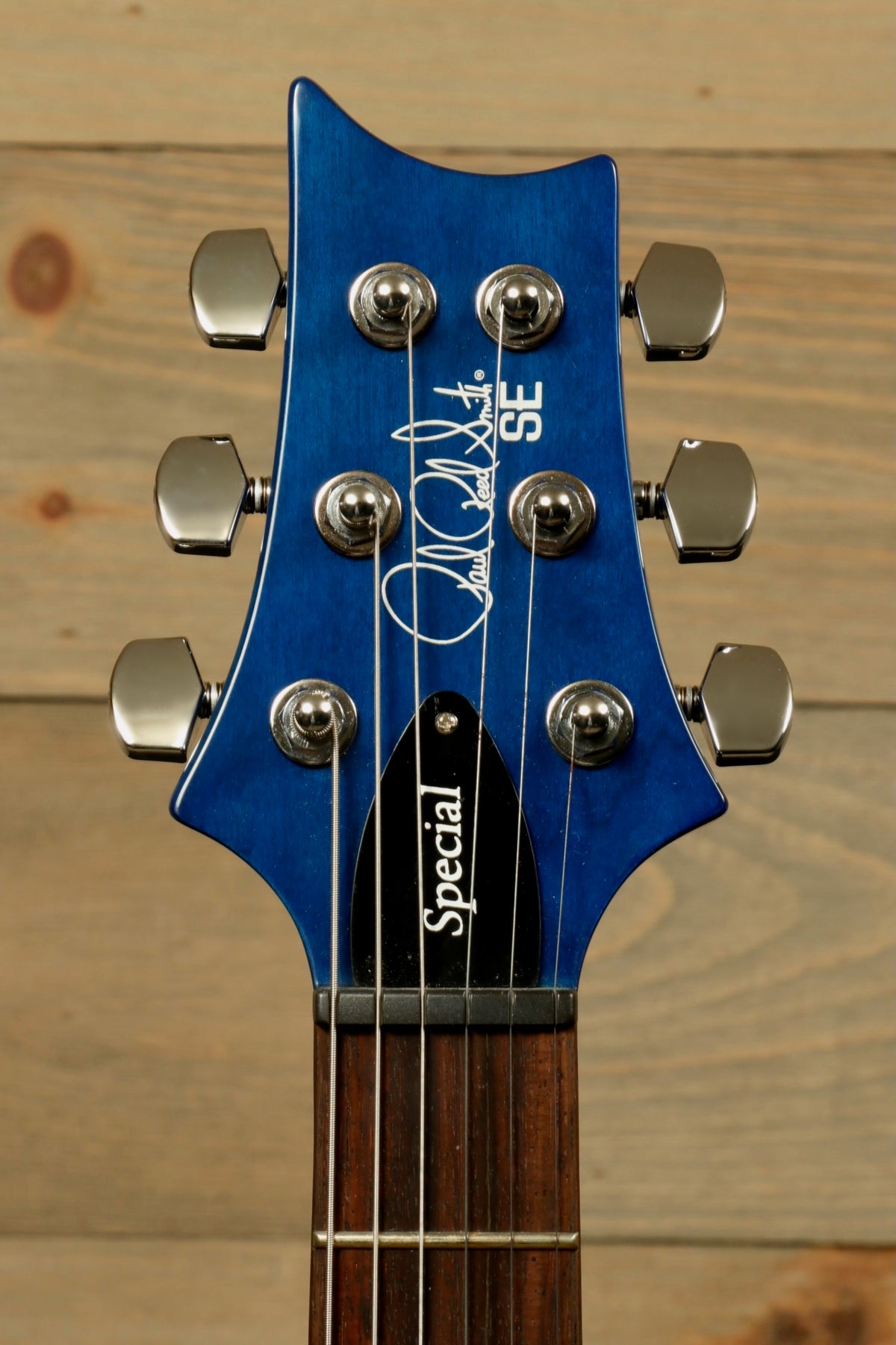 PRS SE Special Semi-Hollow electric guitar in blue, headstock view showing tuning pegs