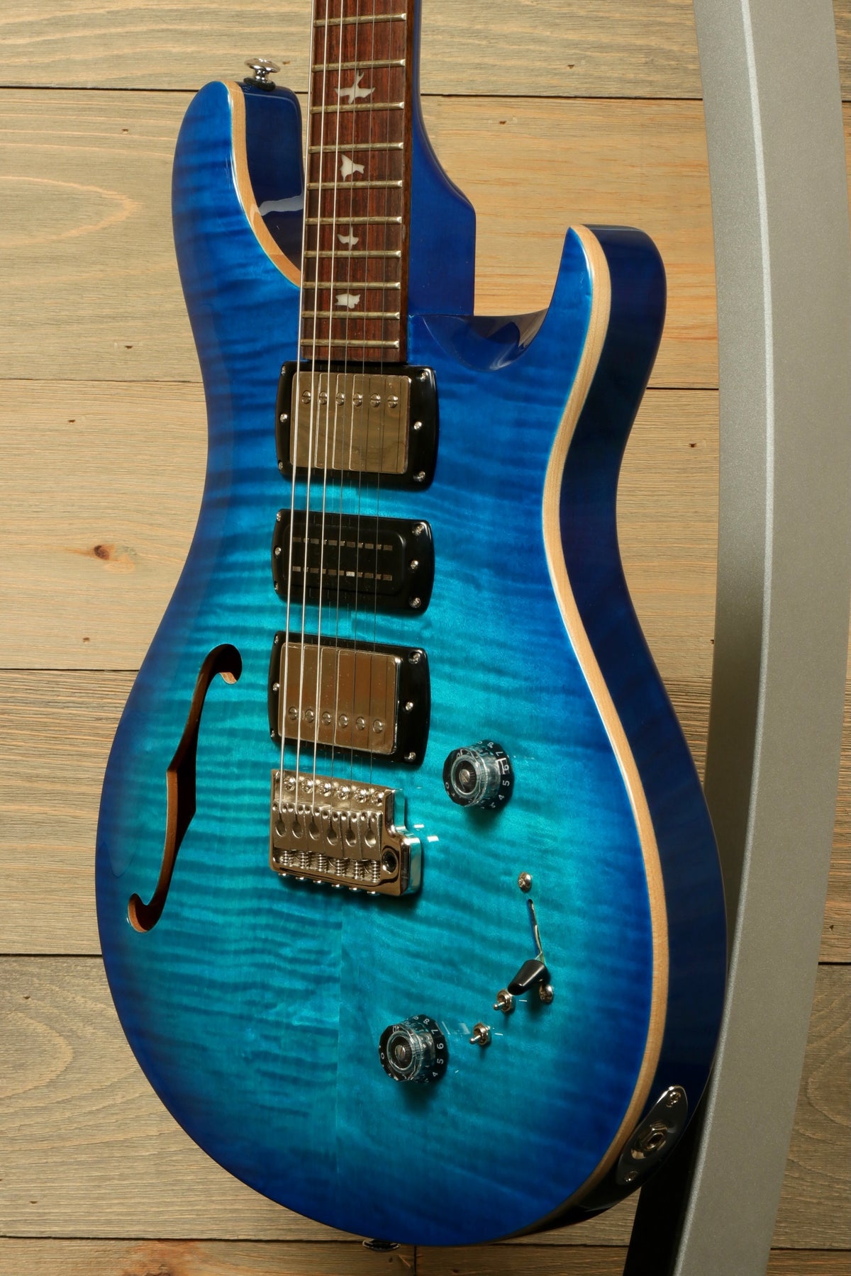 Used PRS SE Special Semi-Hollow electric guitar in vibrant blue, front view showcasing its unique finish