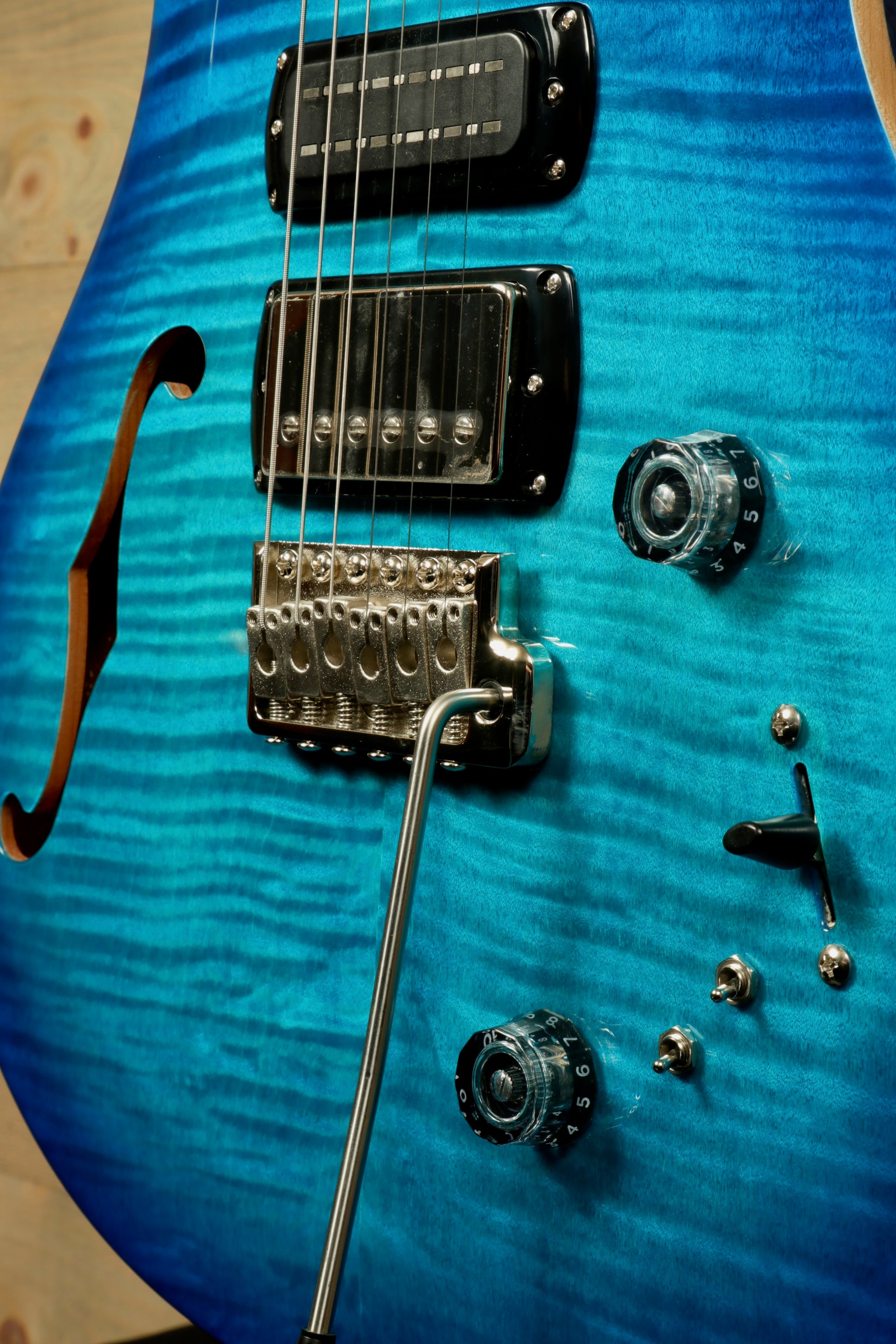 PRS SE Special Semi-Hollow electric guitar in vibrant blue with elegant curves and chrome hardware