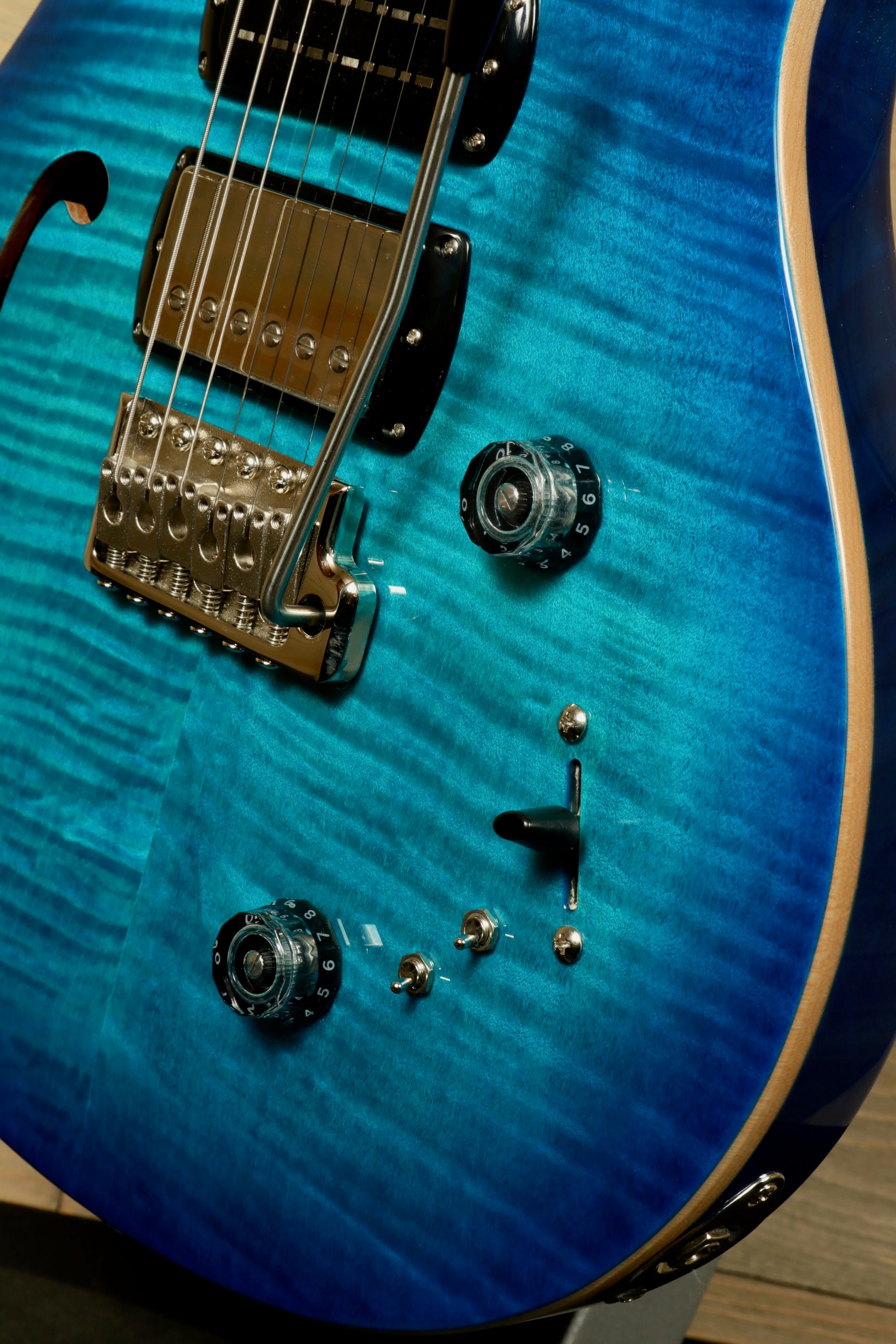 PRS SE Special Semi-Hollow electric guitar in blue with detailed body and control knobs