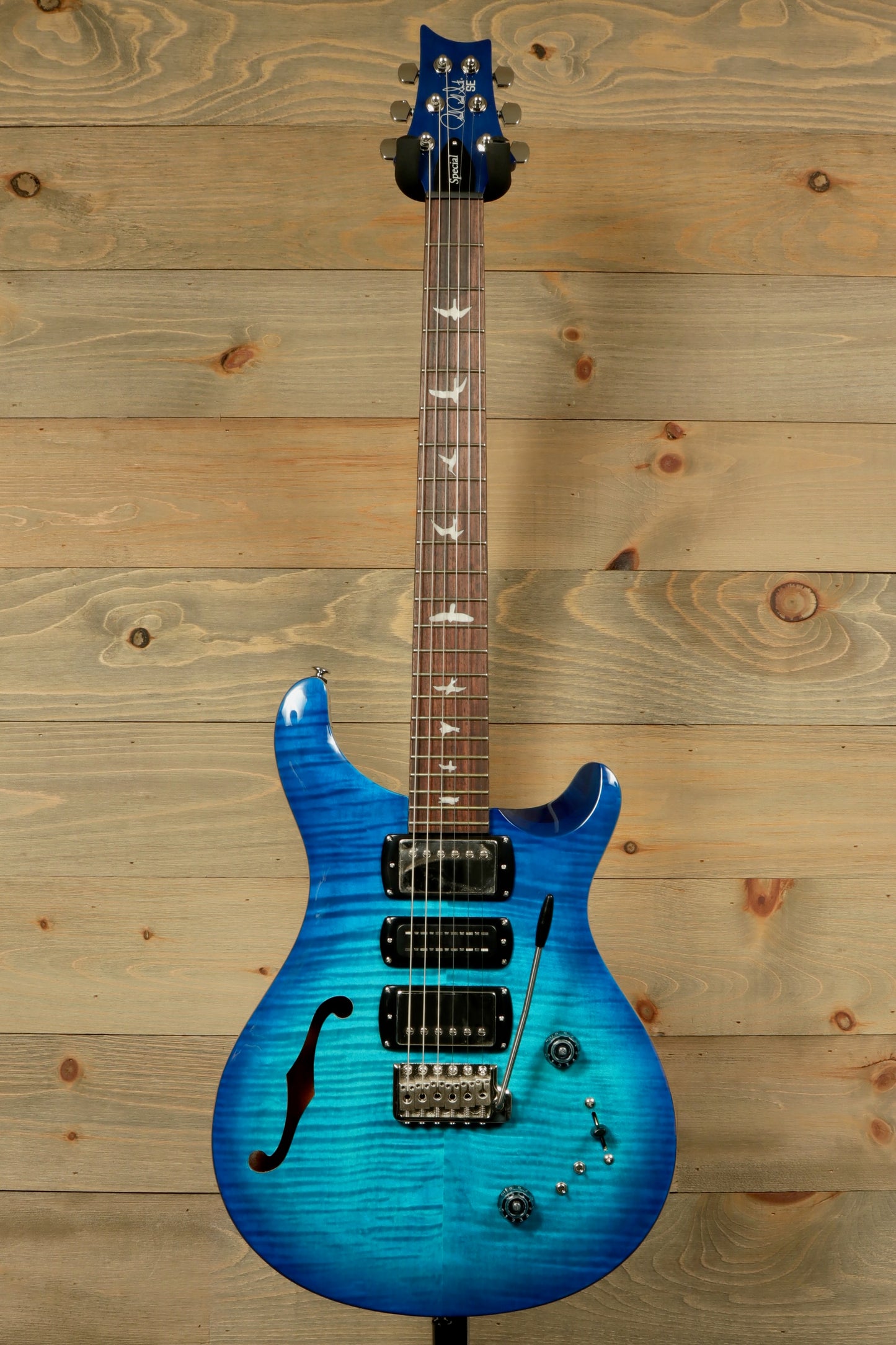 PRS SE Special Semi-Hollow electric guitar in blue finish with stylish curves and detailed inlays