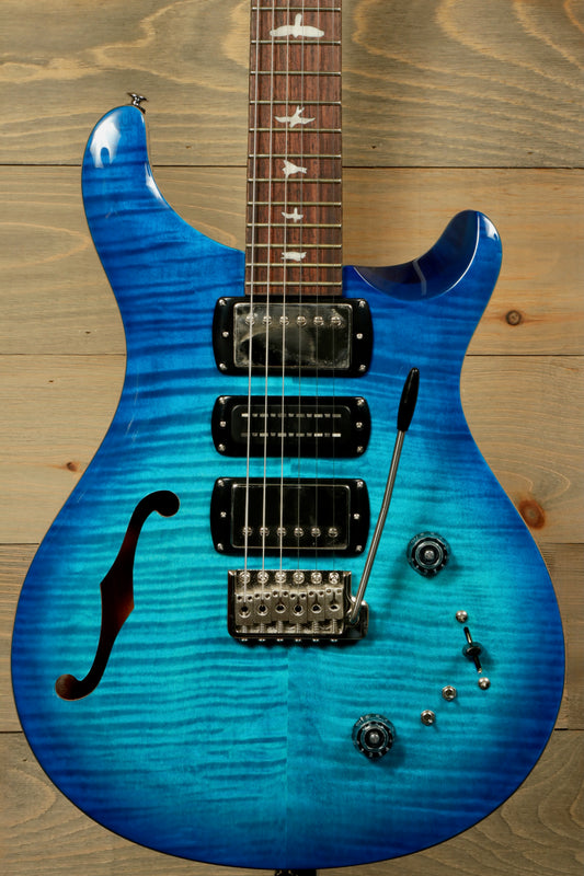 PRS SE Special Semi-Hollow electric guitar in blue with a stylish finish and elegant design
