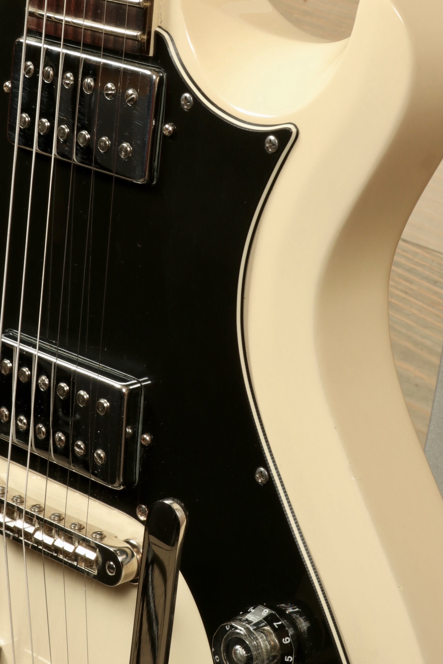 PRS Starla S2 in cream finish with black pickguard, close-up view of the body and controls