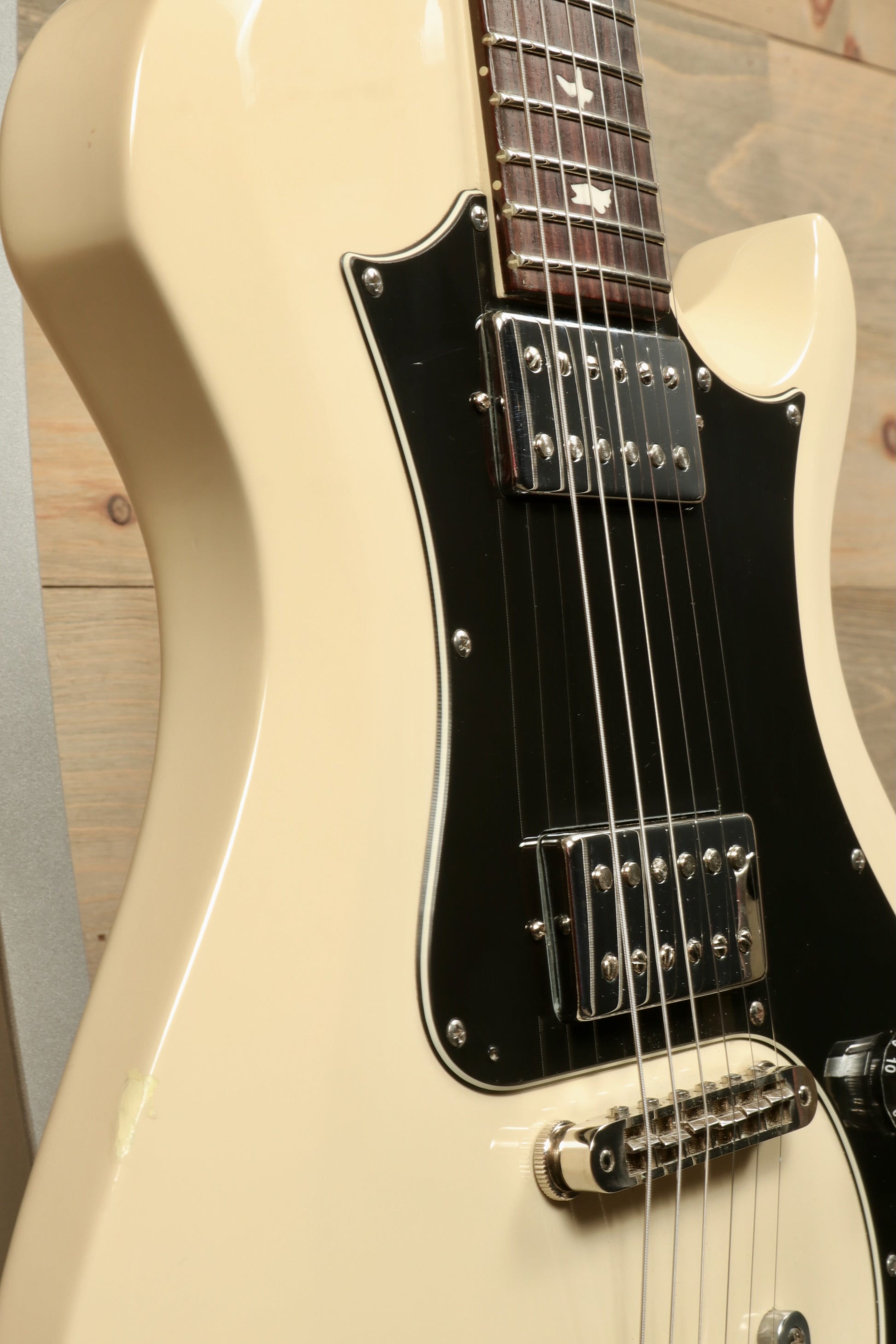 PRS Starla S2 cream finish with black pickguard, side view showcasing the body and hardware