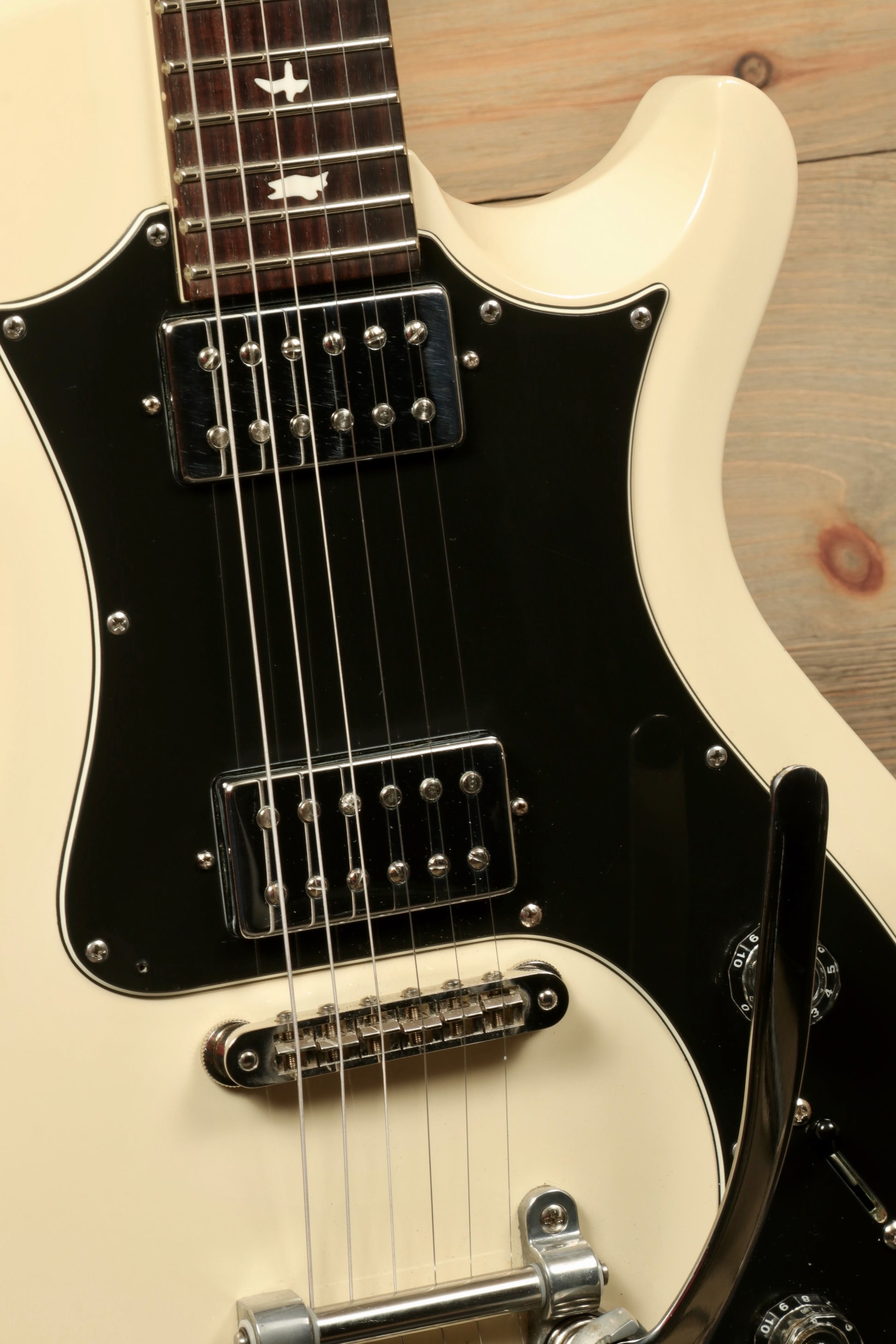 PRS Starla S2 in cream with black accents, showcasing the body and pickups from a close-up view