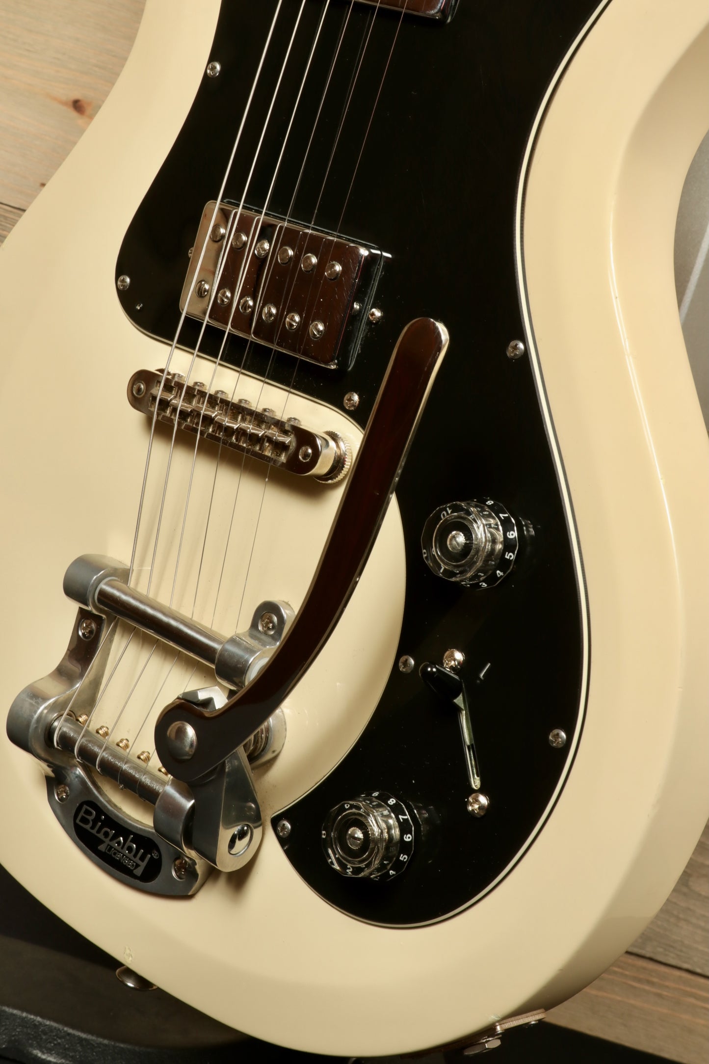 PRS Starla S2 in cream color, showcasing the Bigsby tremolo and control knobs, angled view