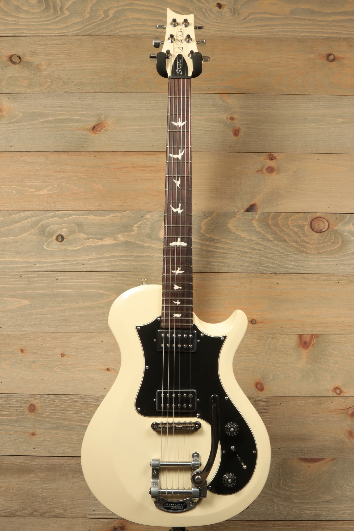 PRS Starla S2 in cream finish, front view with black pickguard and decorative inlays
