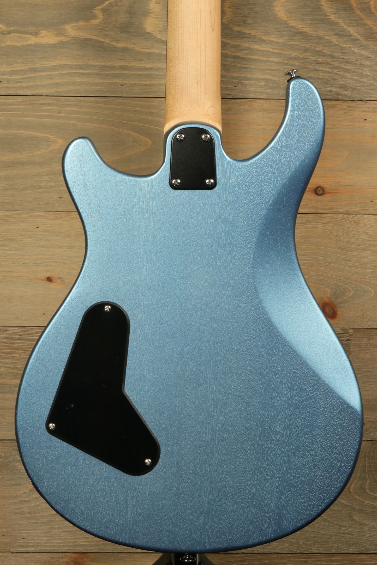 Back view of PRS Stop Tail guitar Metro East in a metallic blue finish showcasing craftsmanship