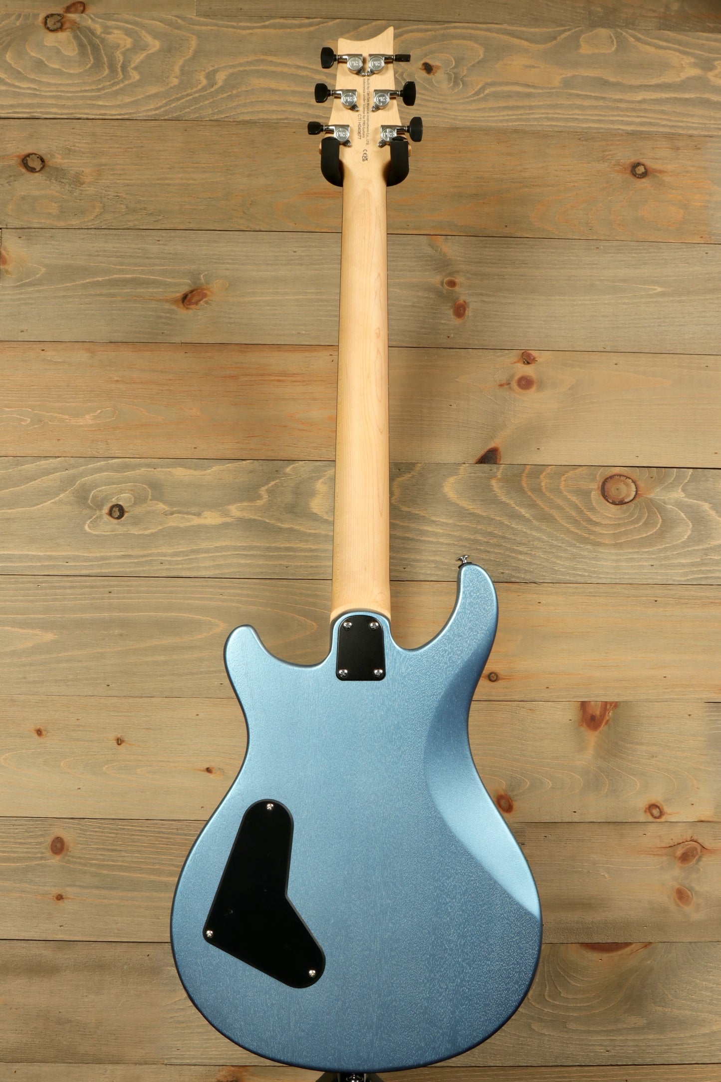 Back view of PRS Stop Tail guitar Metro East in blue finish with smooth contours and sleek design