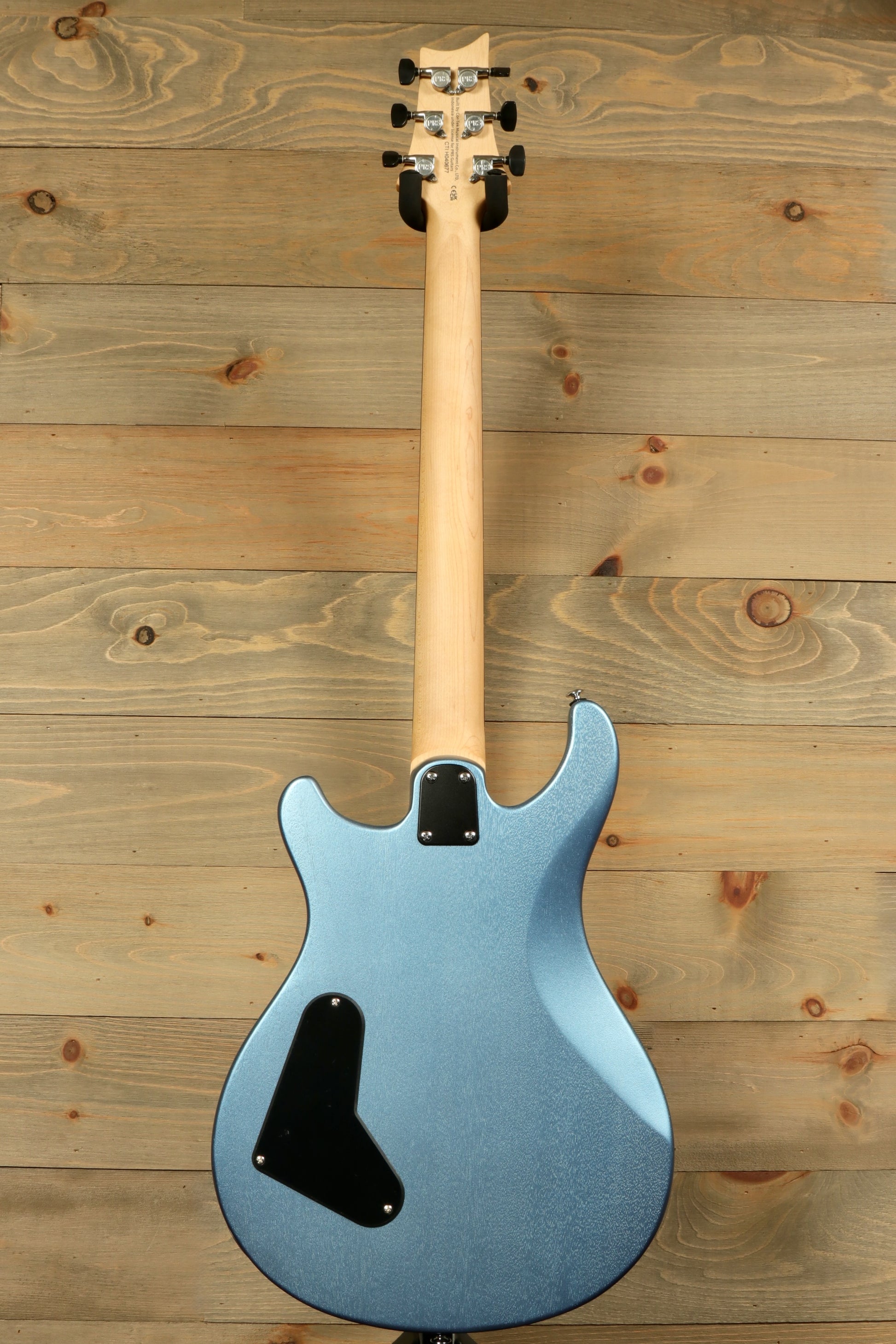 Back view of PRS Stop Tail guitar Metro East in blue finish with smooth contours and sleek design
