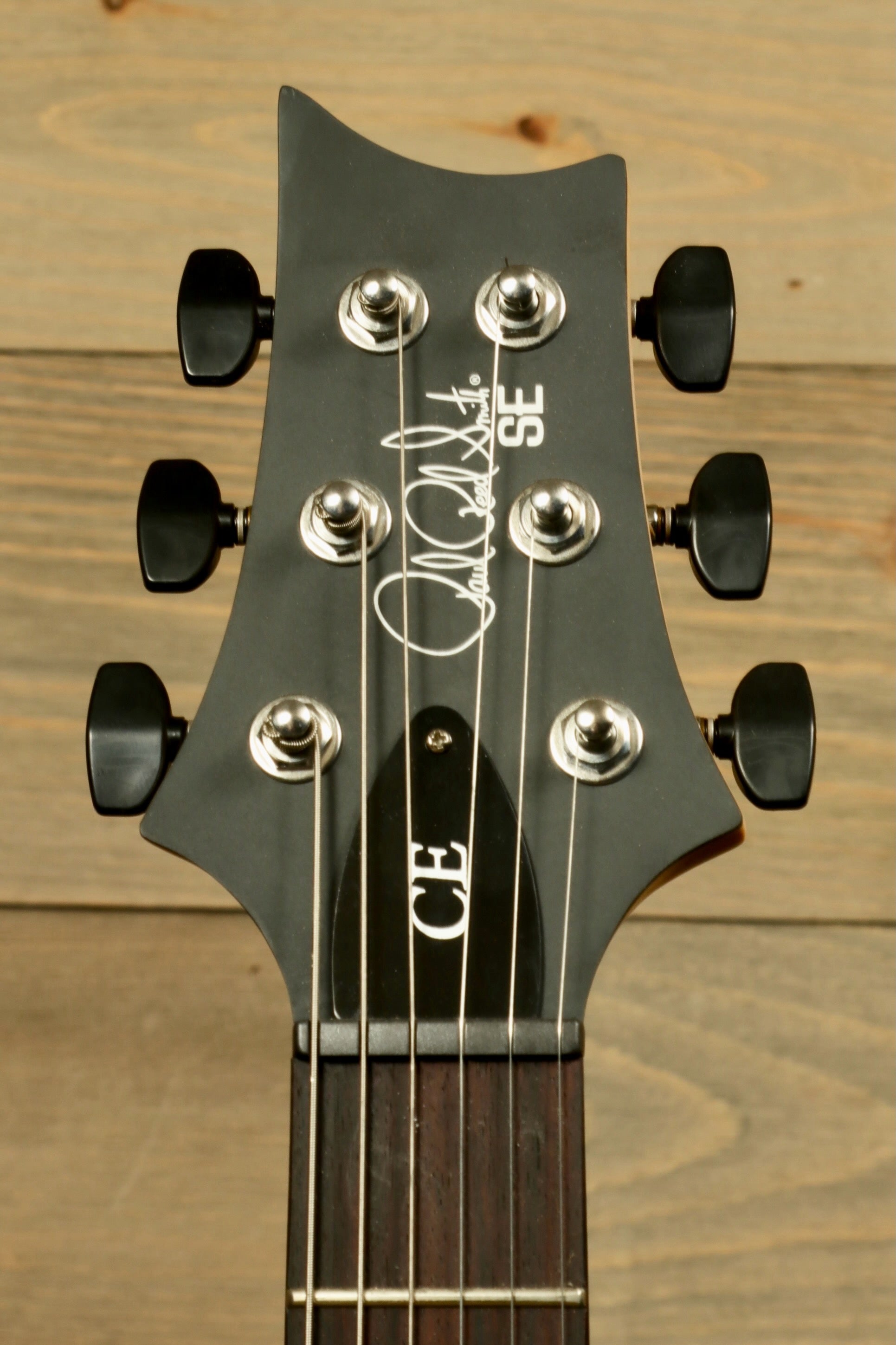PRS Stop Tail guitar Metro East headstock with detailed tuning pegs and logo design