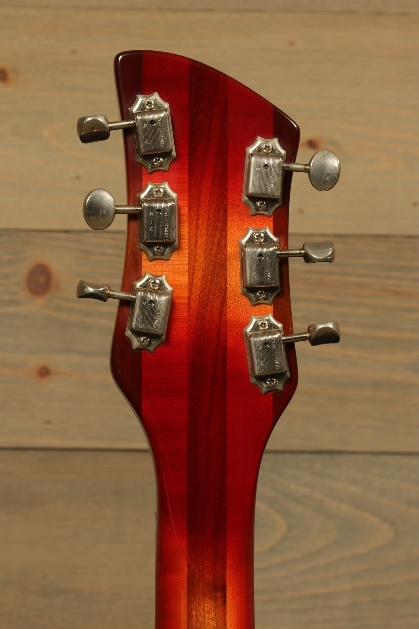 Rickenbacker 360 guitar headstock in sunburst finish, rear view showing tuning pegs