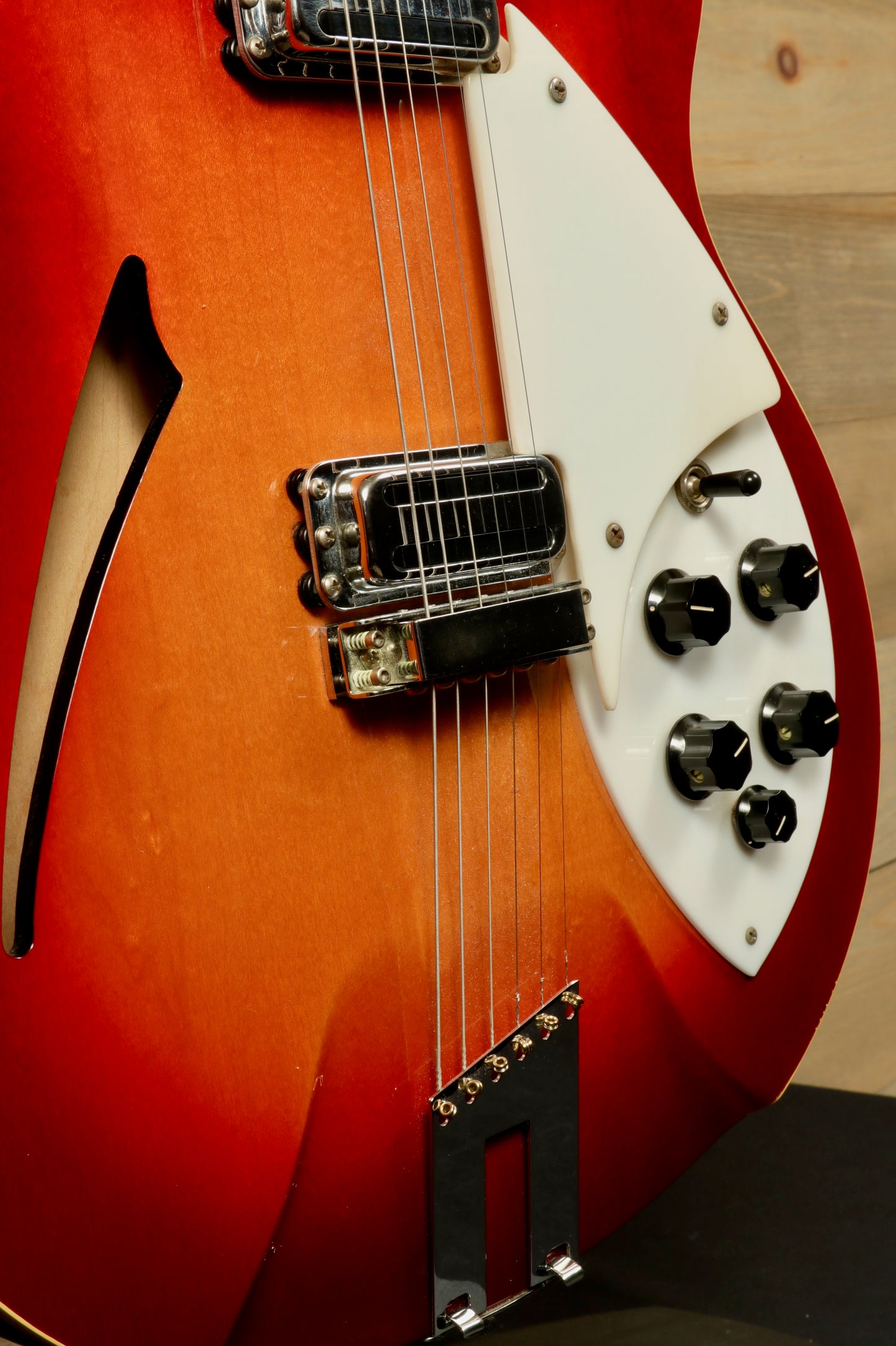 Rickenbacker 360 hollow body electric guitar, sunburst finish, close-up view of body and controls